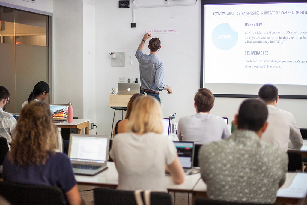 A warm candid of a practitioner mid-process, reflecting active learning in real time.