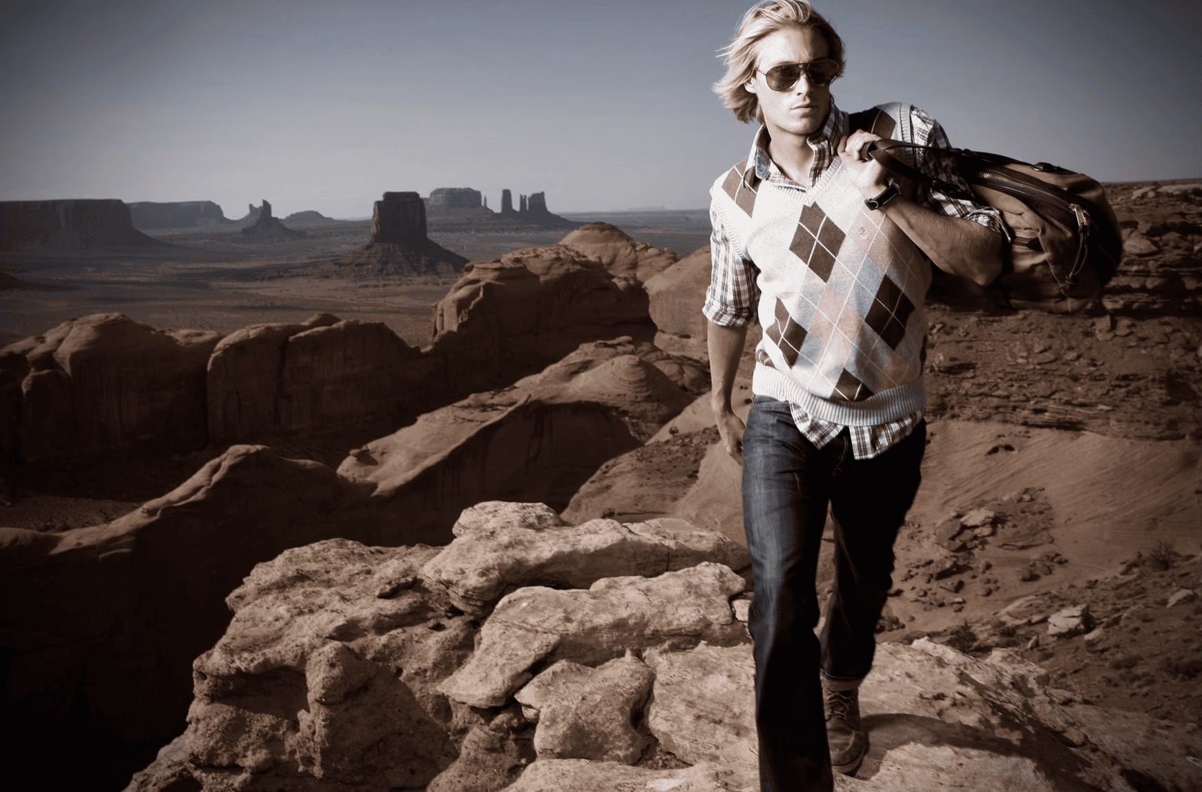 Male fashion portrait in a monumental desert landscape