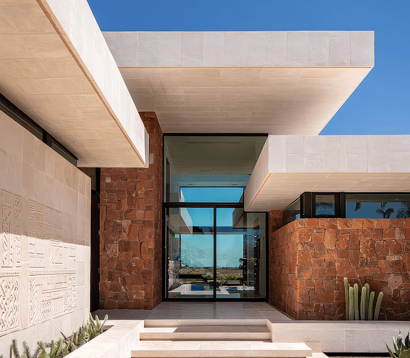 Modern low profile house with glass walls and garden view
