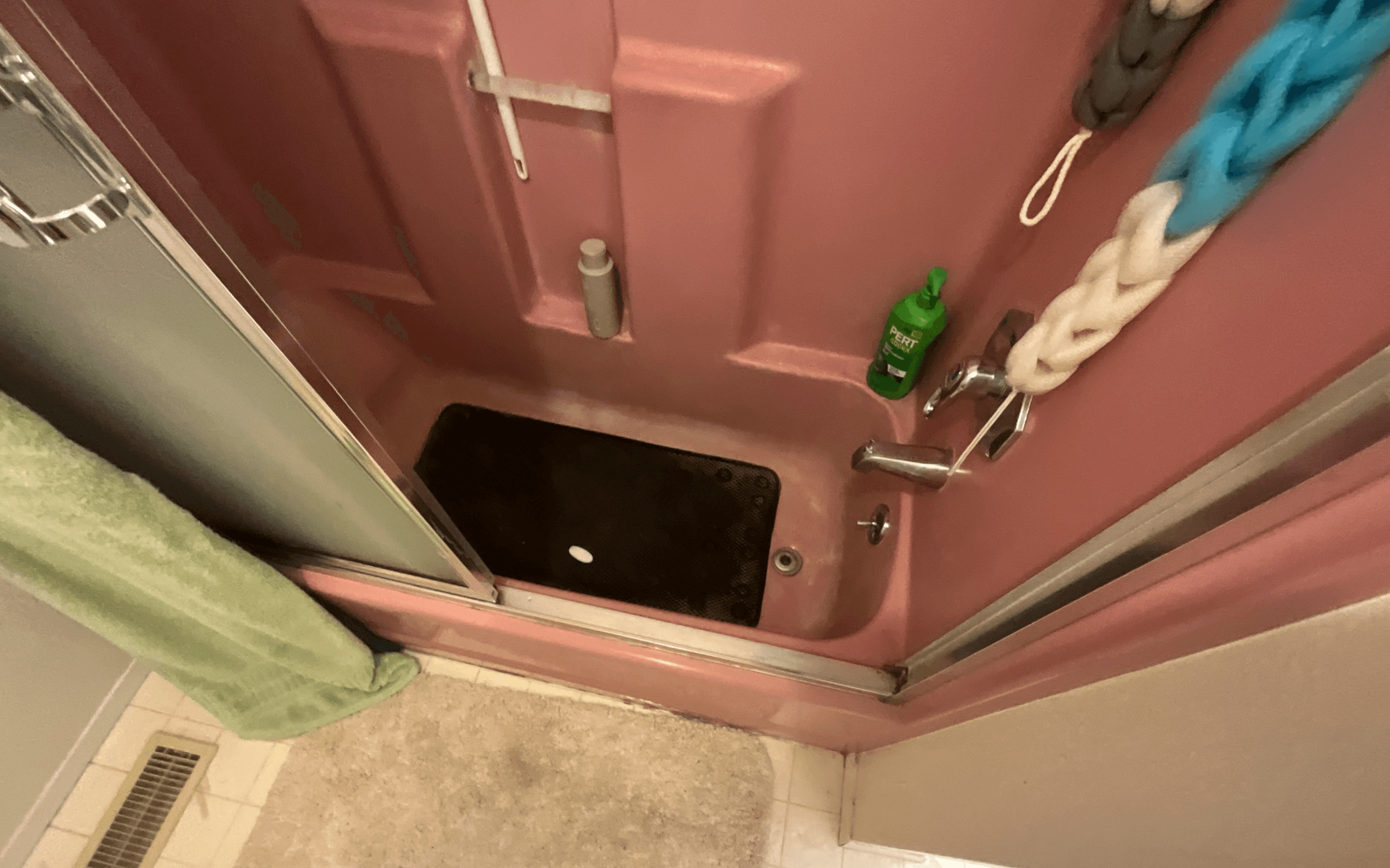 Dated single-piece tub and shower combo before Federal Way replacement