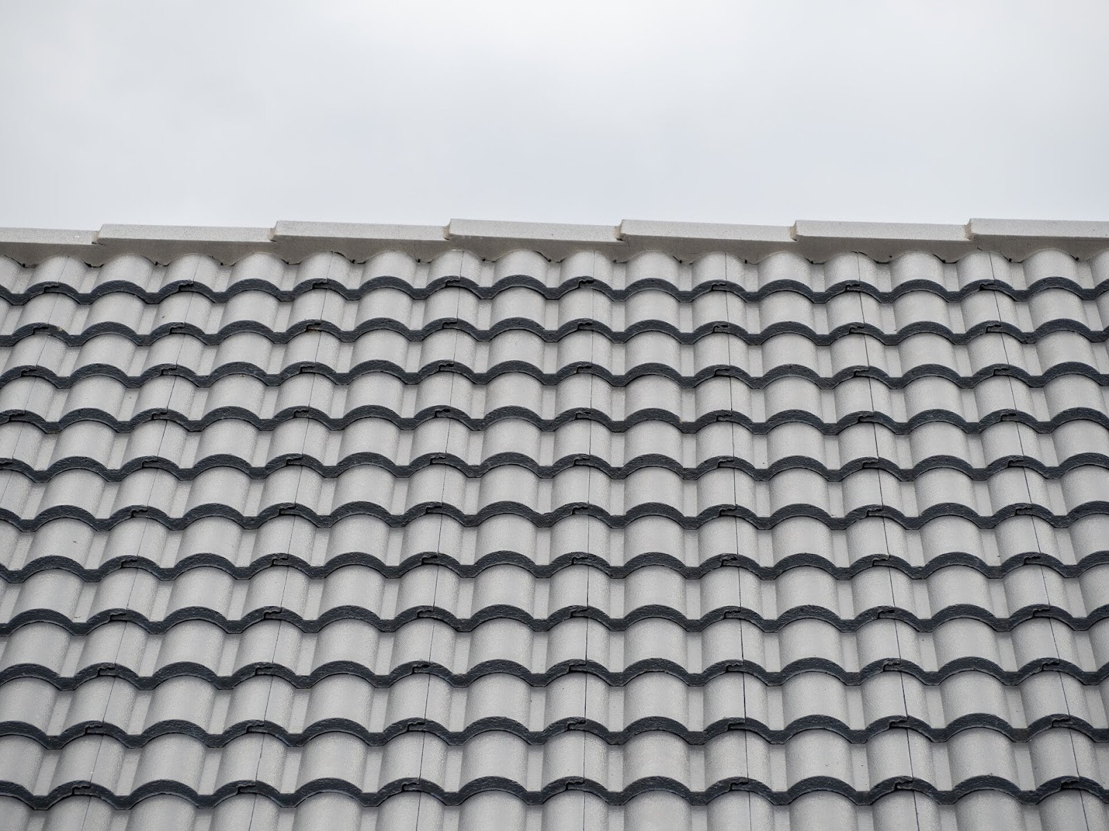 Explore roof tiles types, including concrete, clay, and slate tiles, to choose the best roofing material for your home.