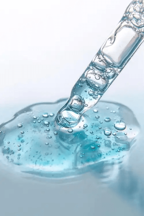 A doctor holding a glowing heart with medical icons floating around it.