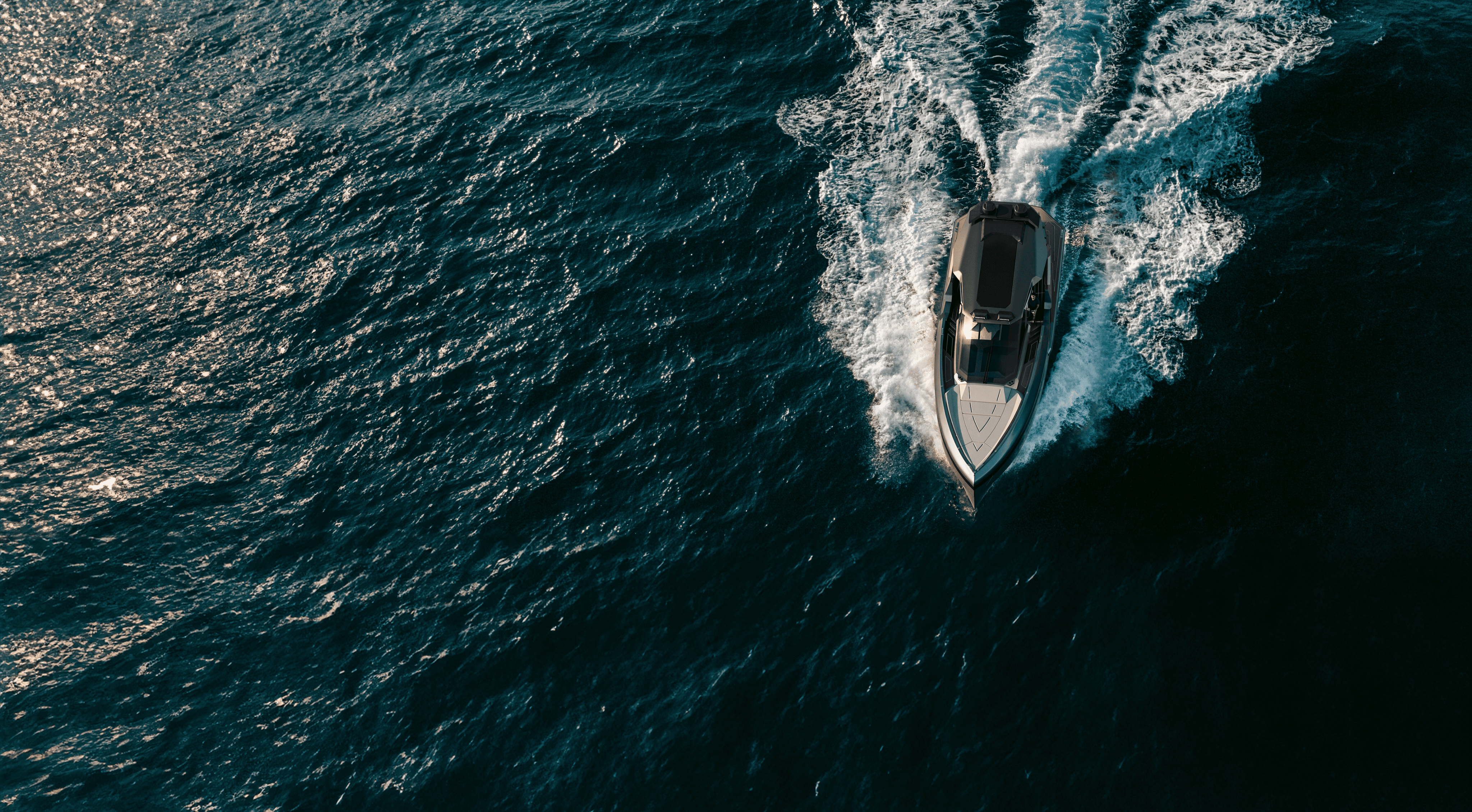 NTO yacht cutting through dark water