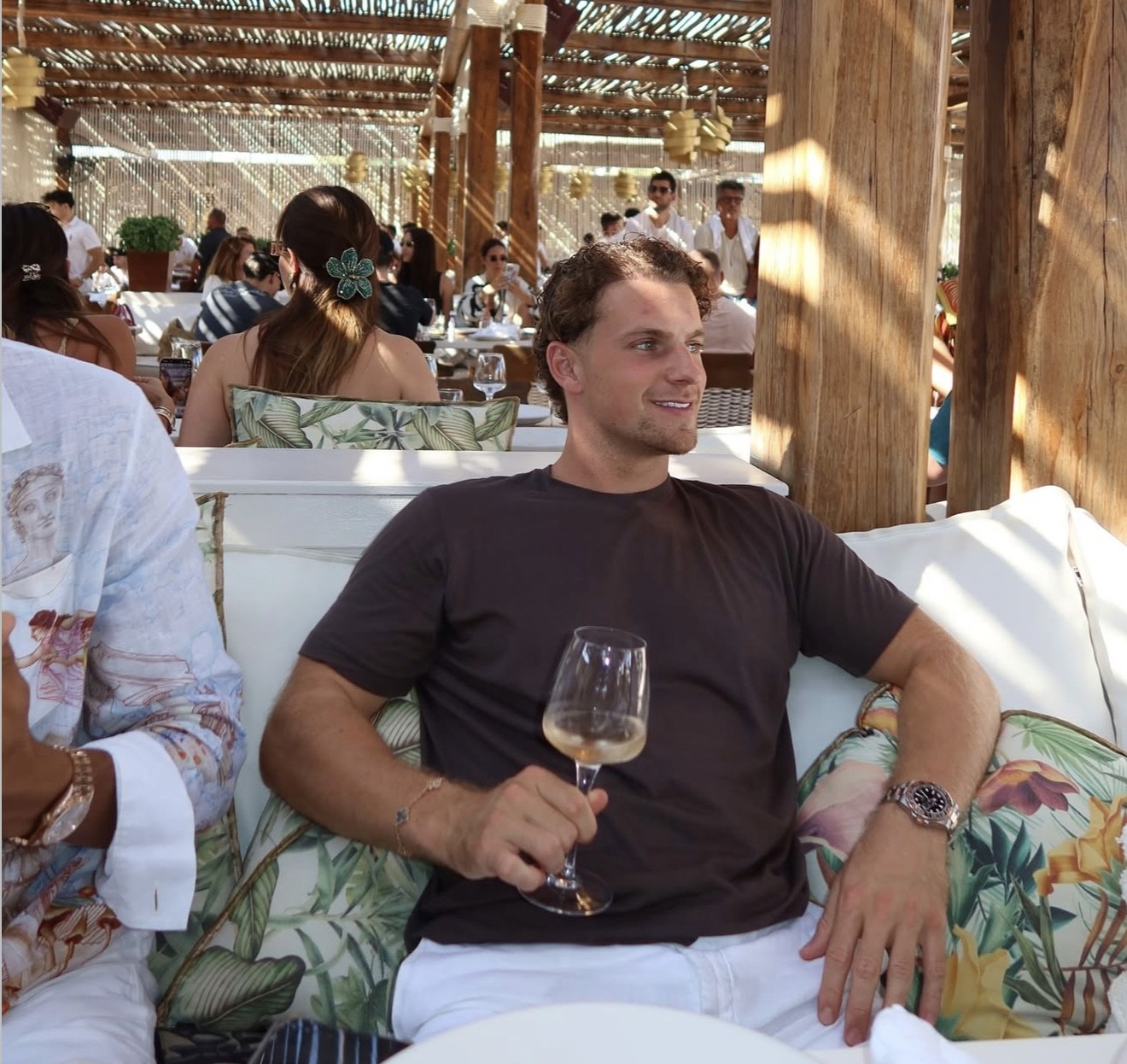 man standing beside wall