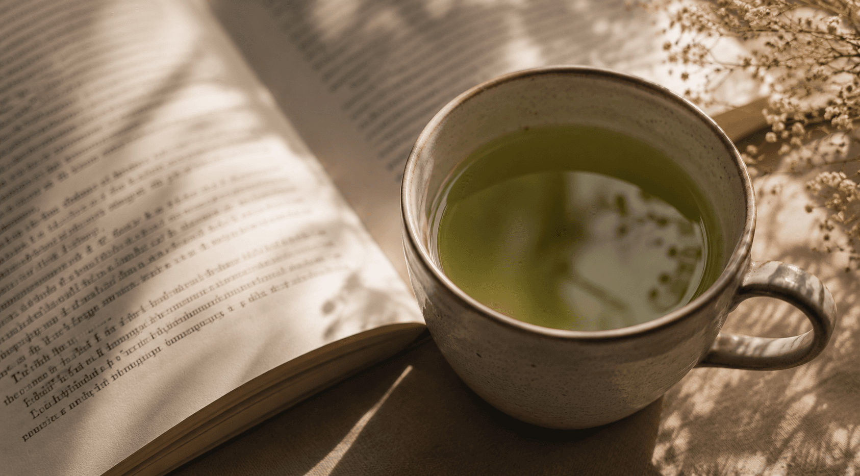Open book and coffee on a warm reading table