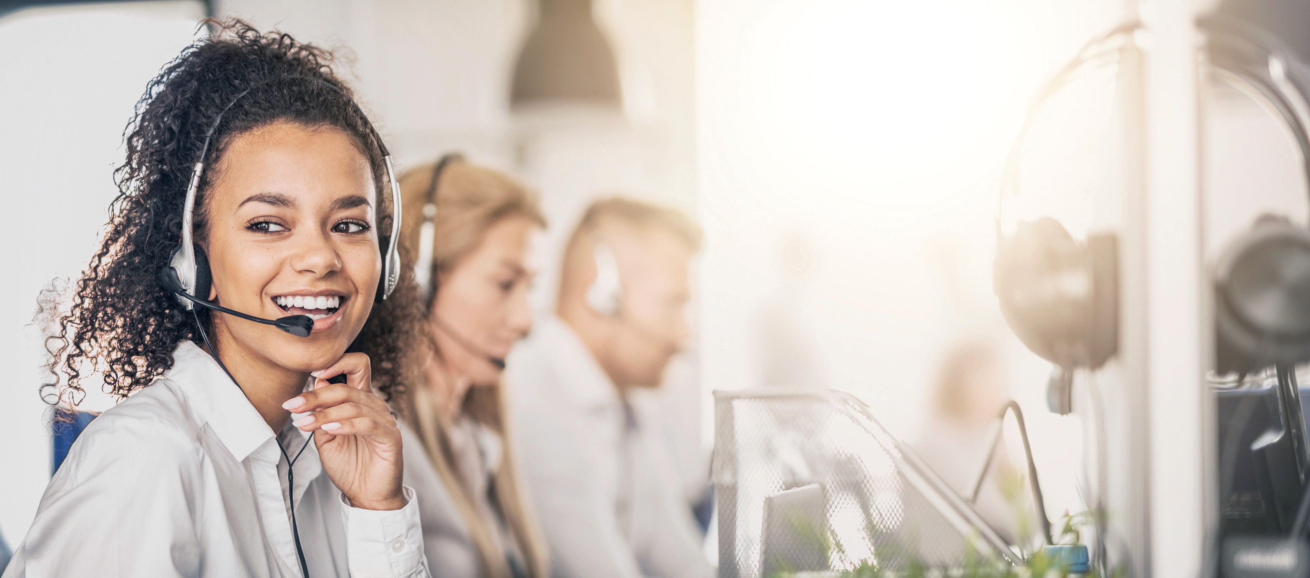 Woman holding a smartphone looking through the glass