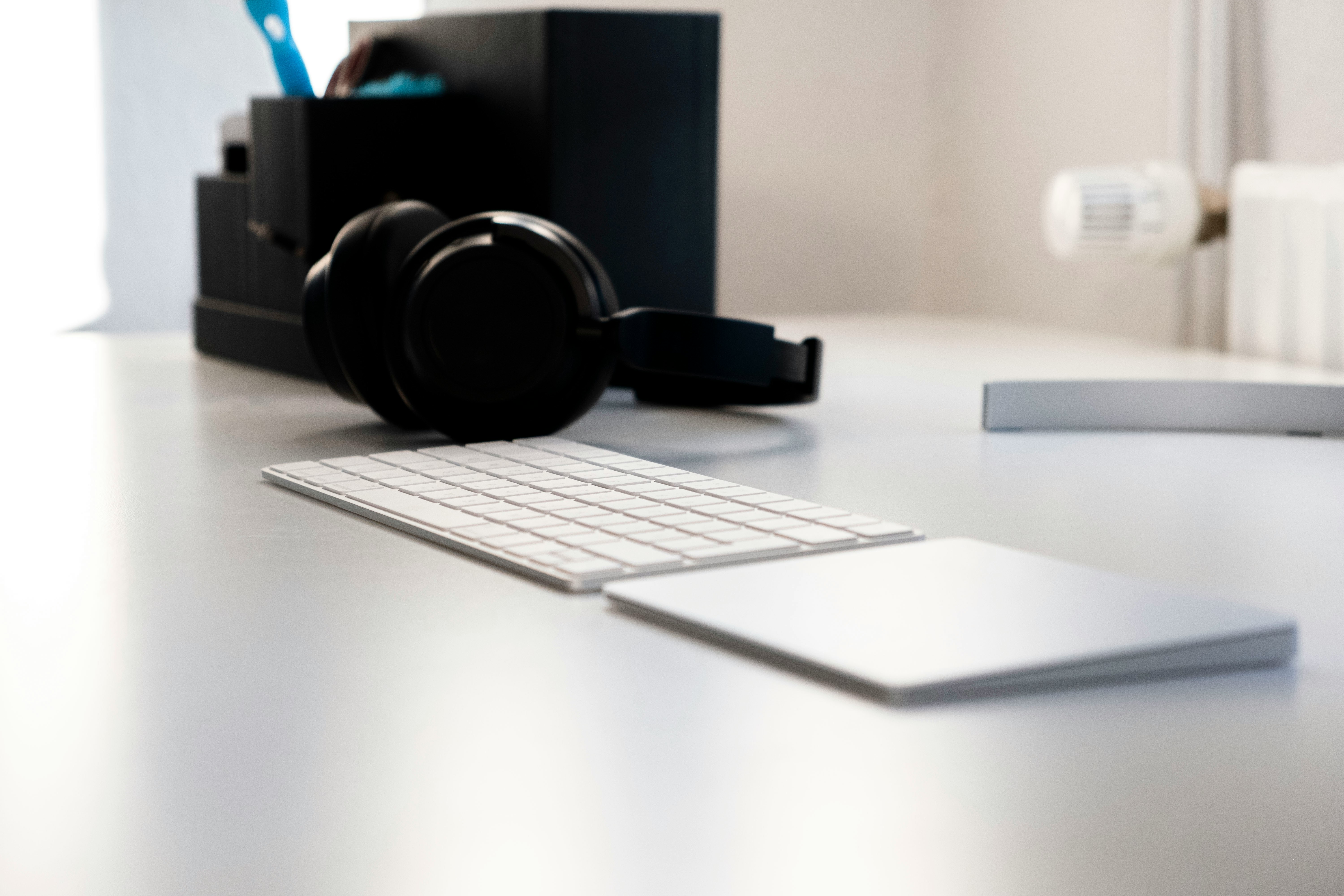 black headphones on white table