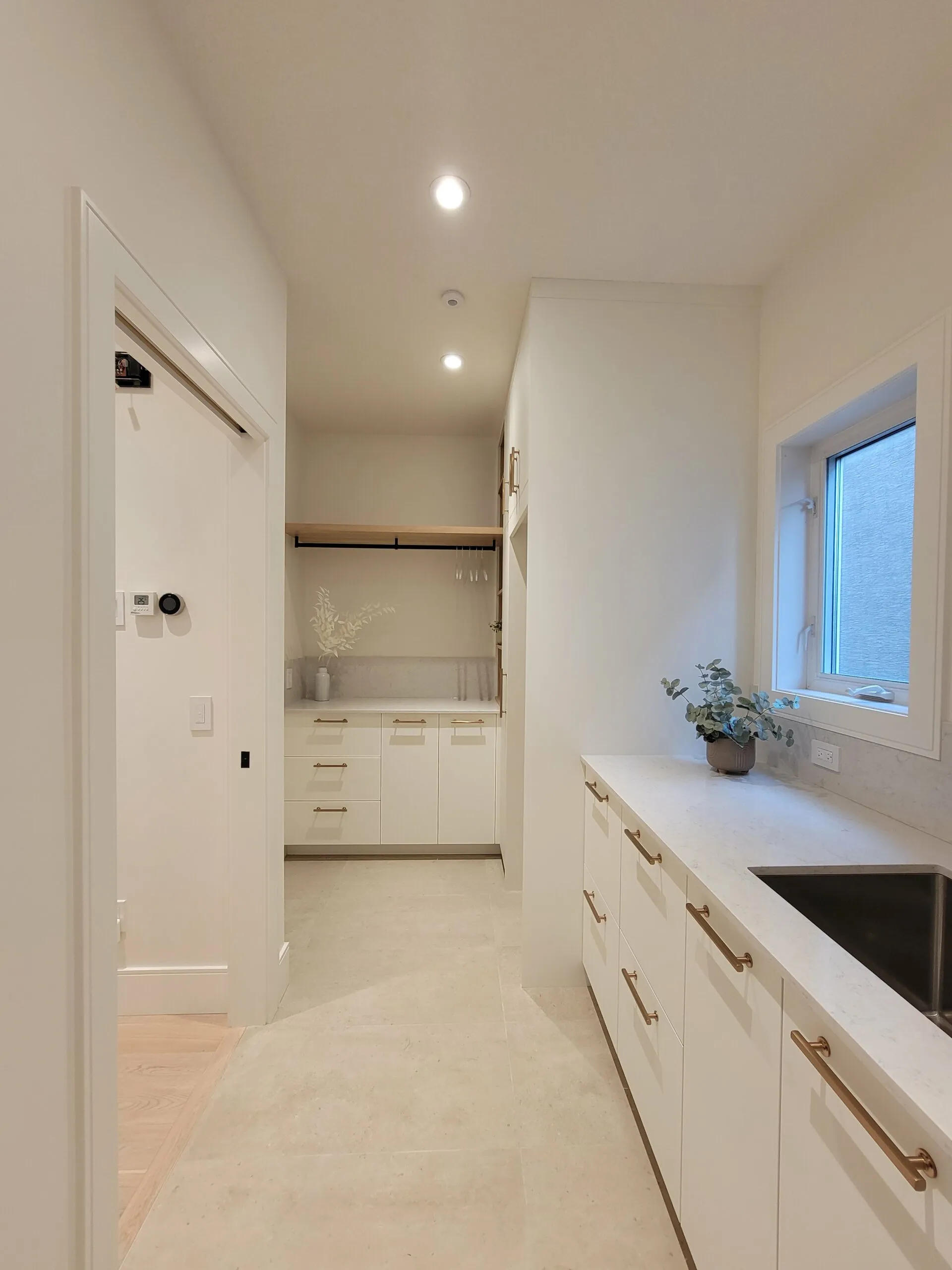 Image of laundry room and mudroom with spacious countertops.