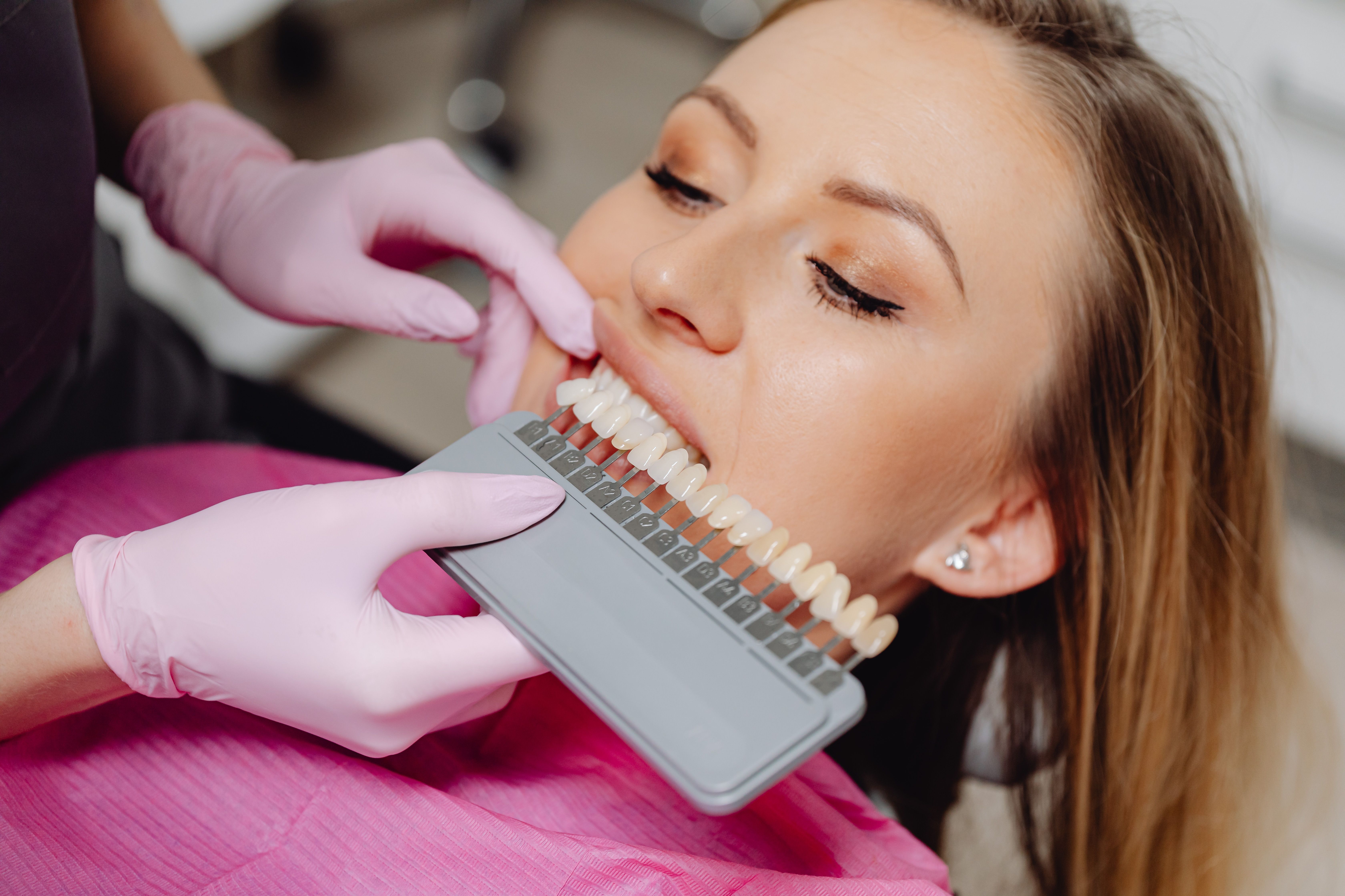 A female dentist fixing teeth