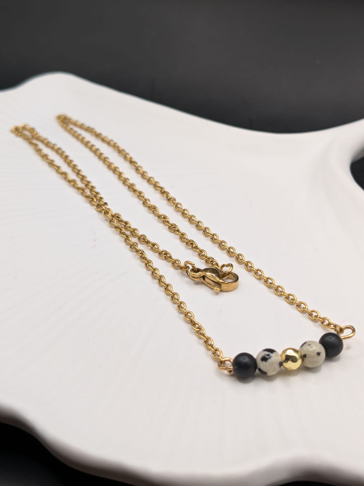 A close-up of hands performing a relaxing massage, with warm golden light illuminating the skin. The scene evokes a sense of relaxation and well-being.