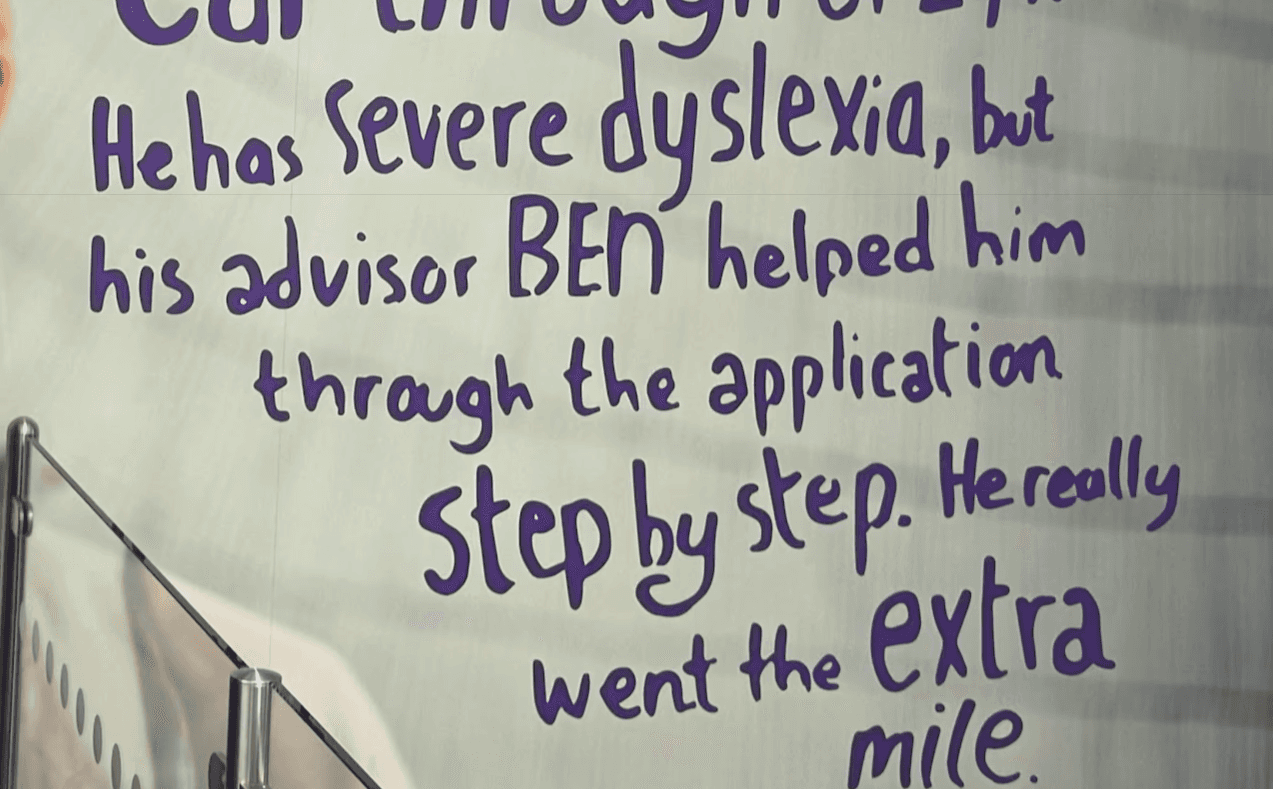 Quote in the wall about the extra mile an agent went for a customer with dislexia