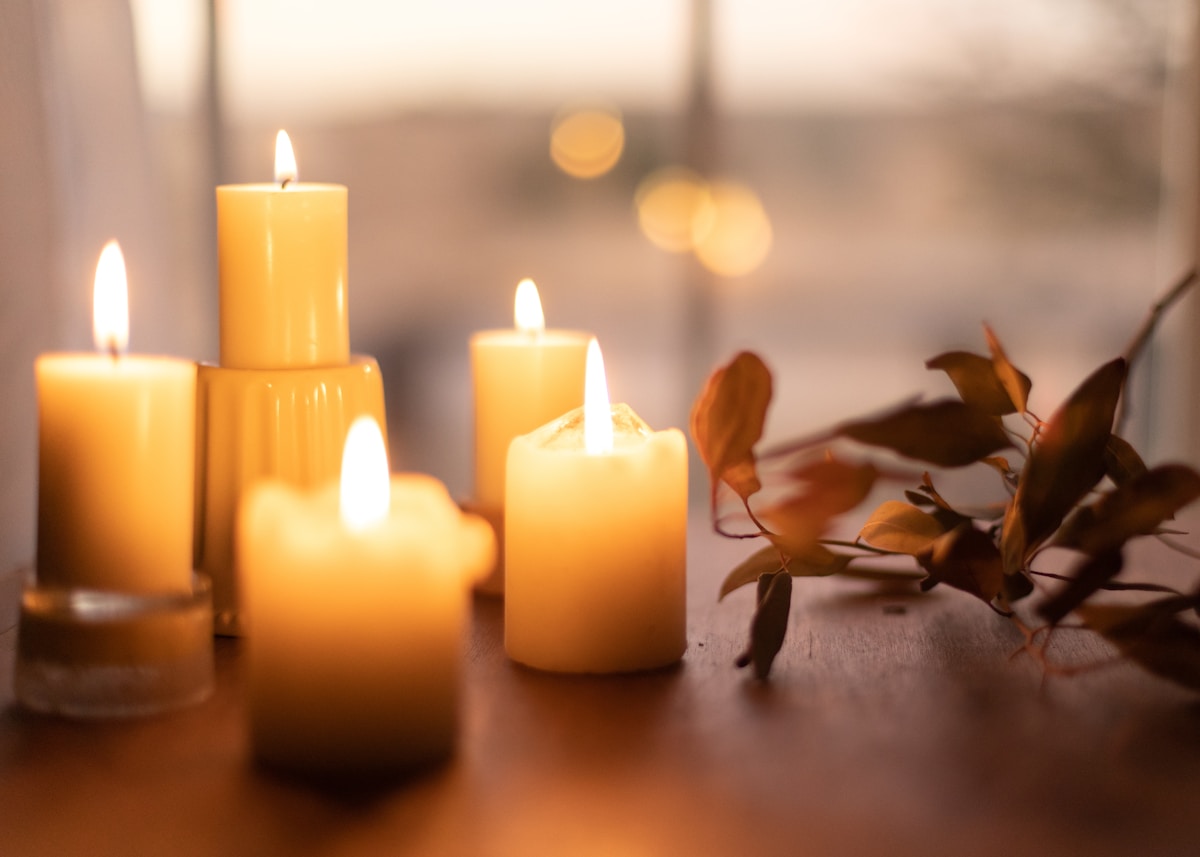 Pillar candles on wood