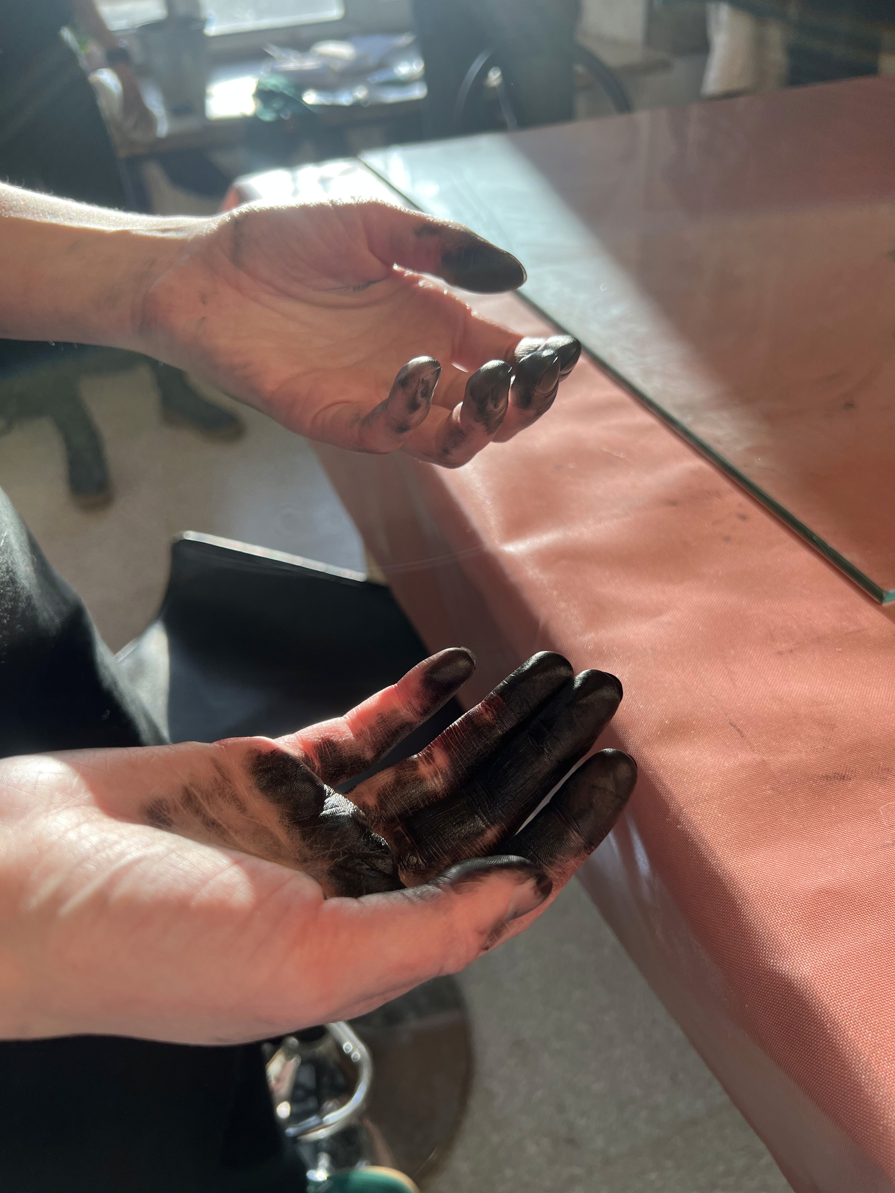 Hands covered in ink