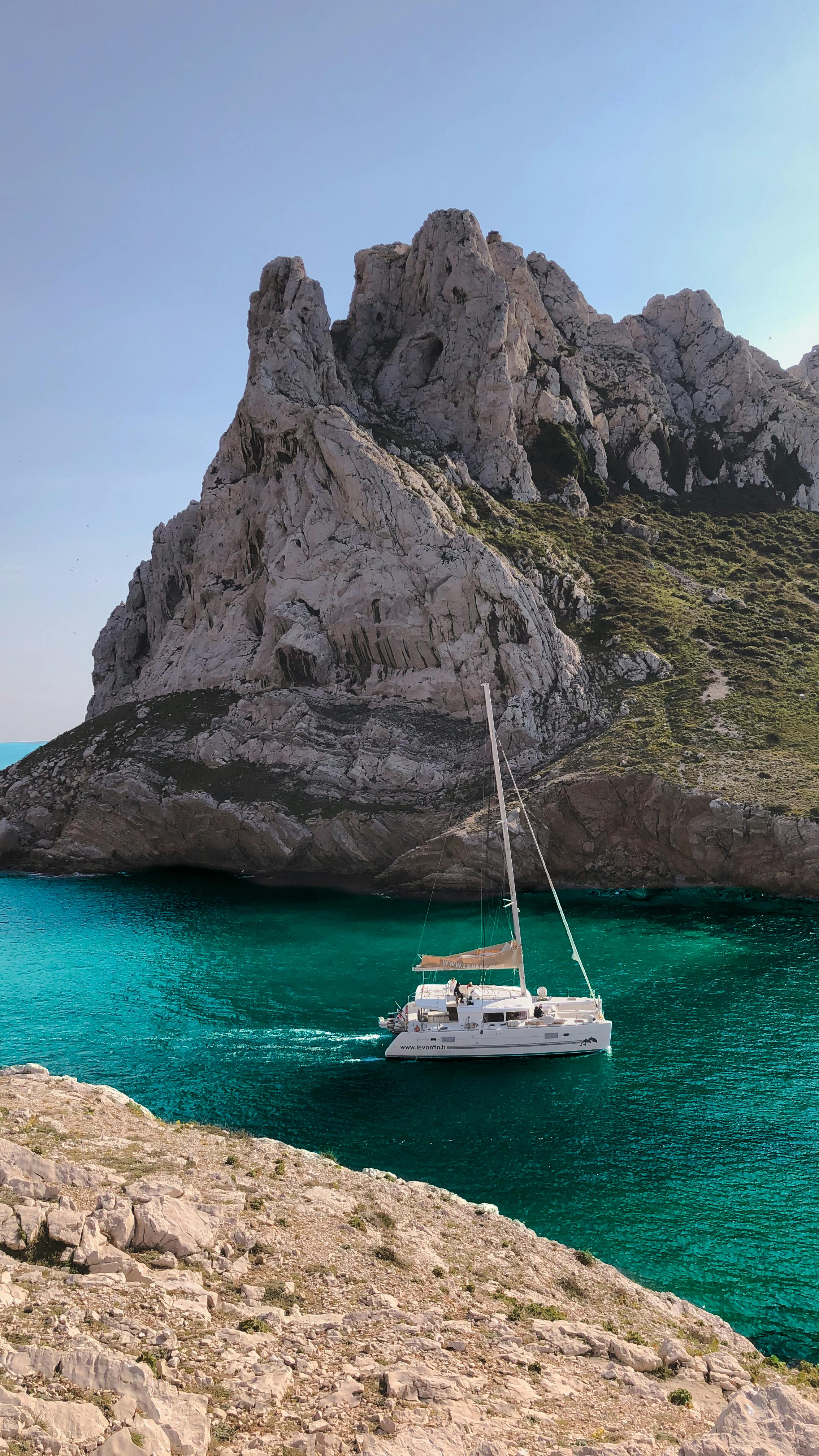 metal faucet statue on swimming pool at daytime