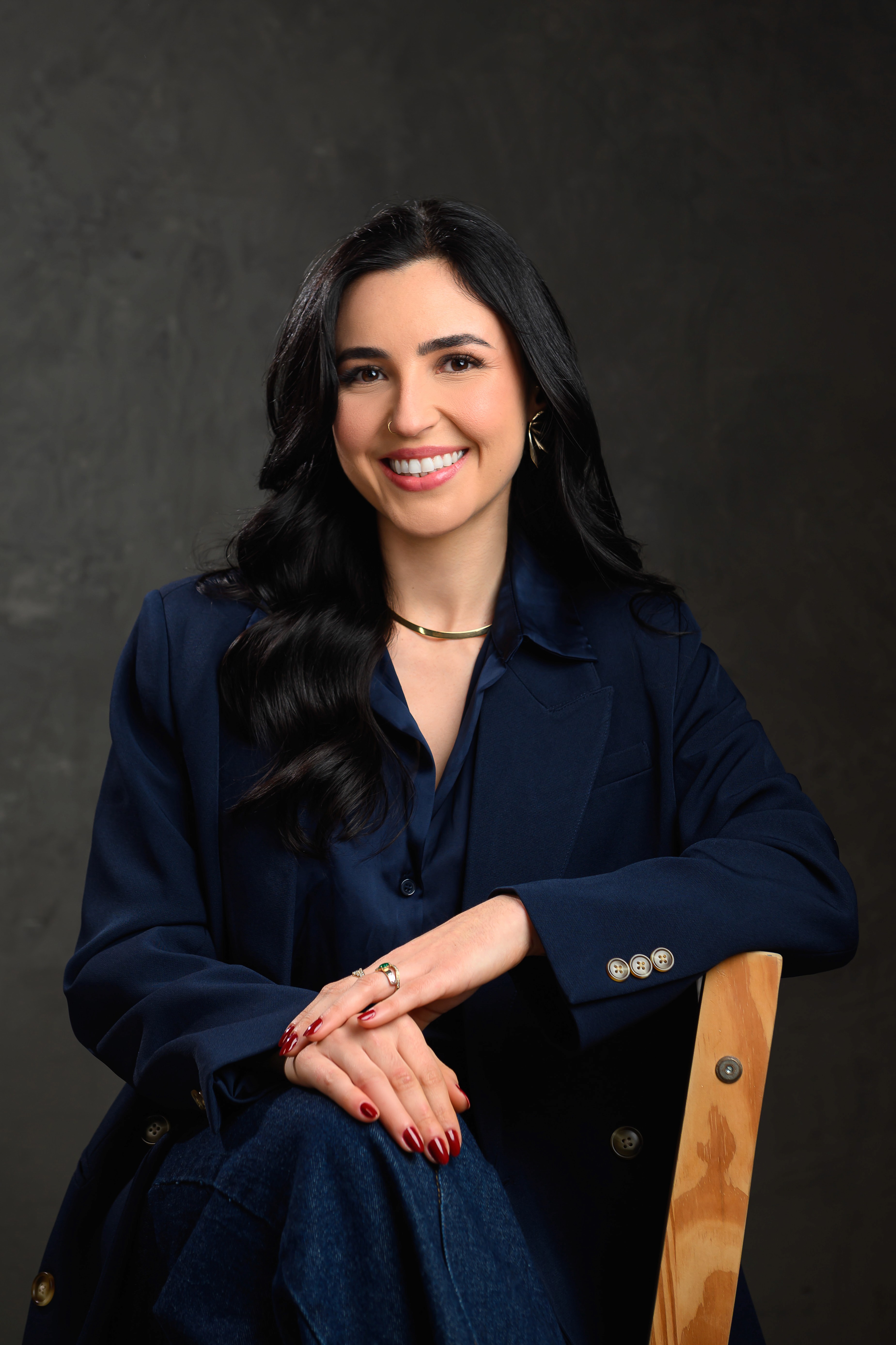 Rachel Stone, personal trainer working out sweaty with a barbell