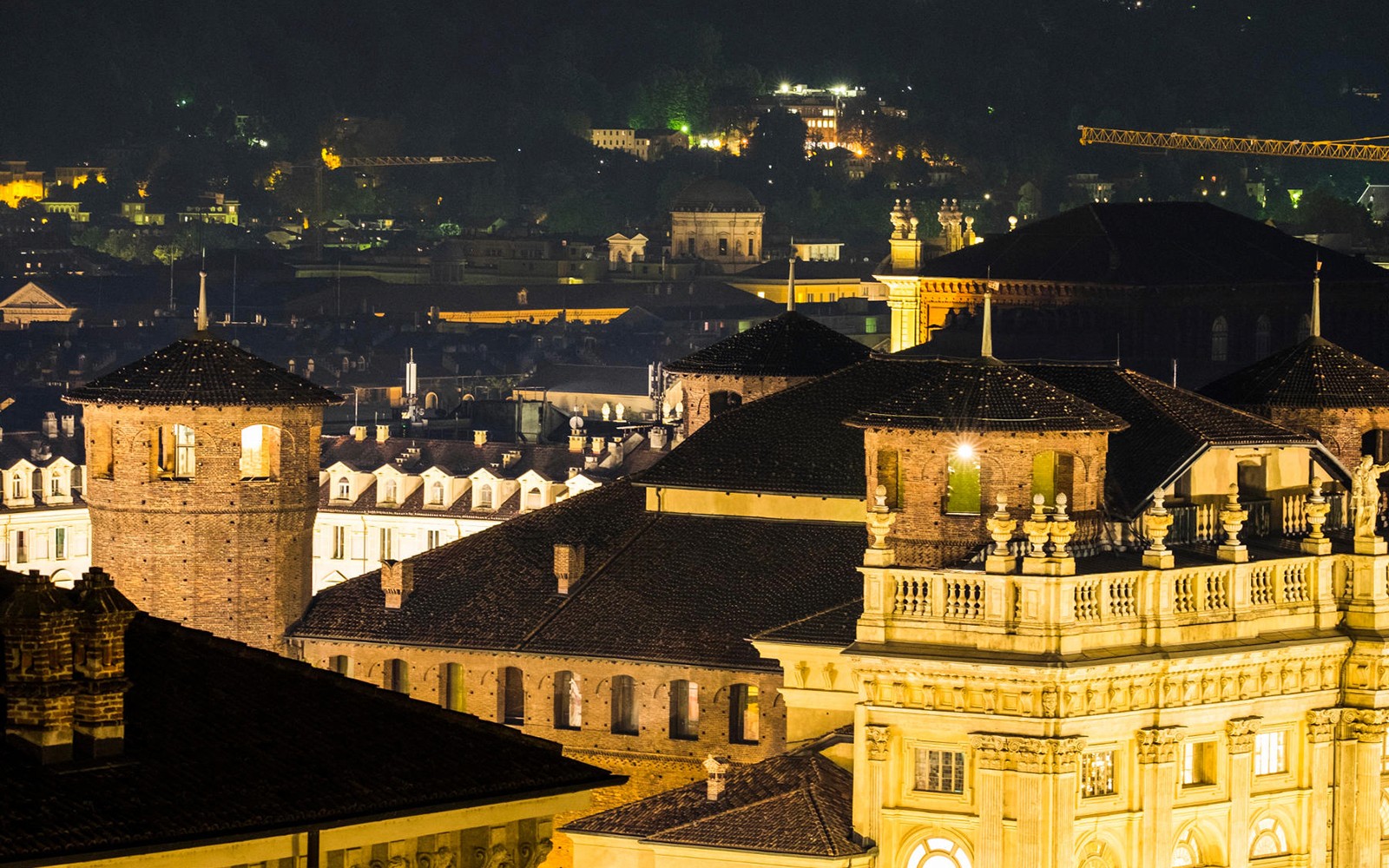 Torino cityscape at night with historic buildings, part of Italian Guided Tour through the Torino Noir.