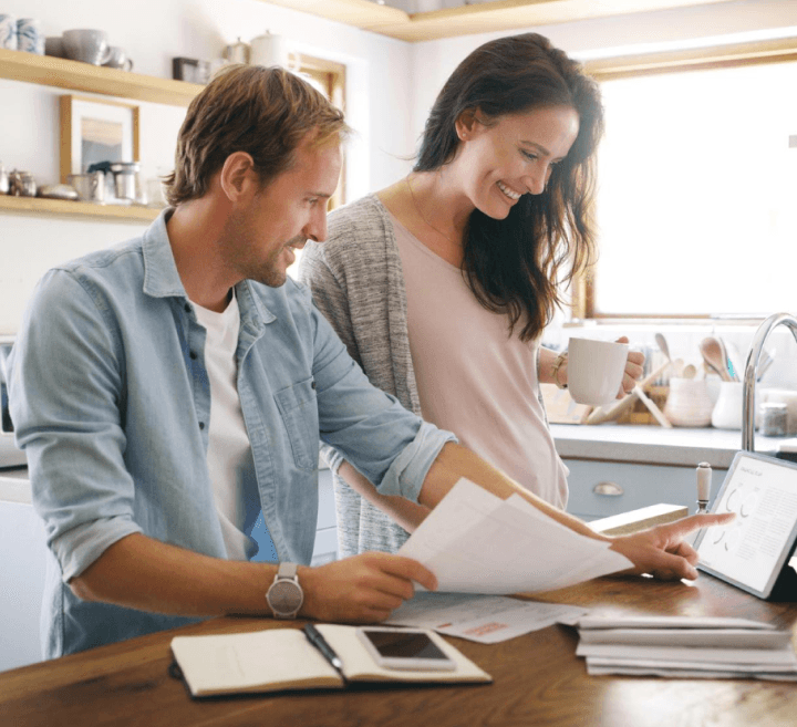 mature couple using tab and documenting