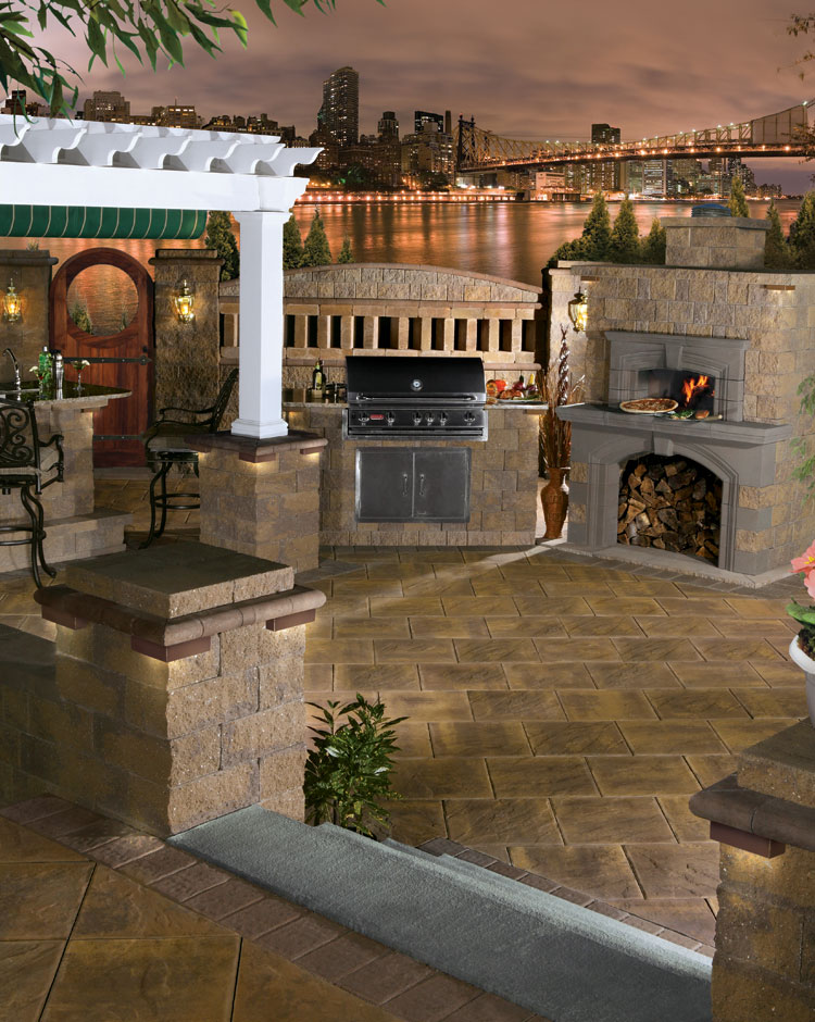 Covered patio kitchen with brick oven and stone counters
