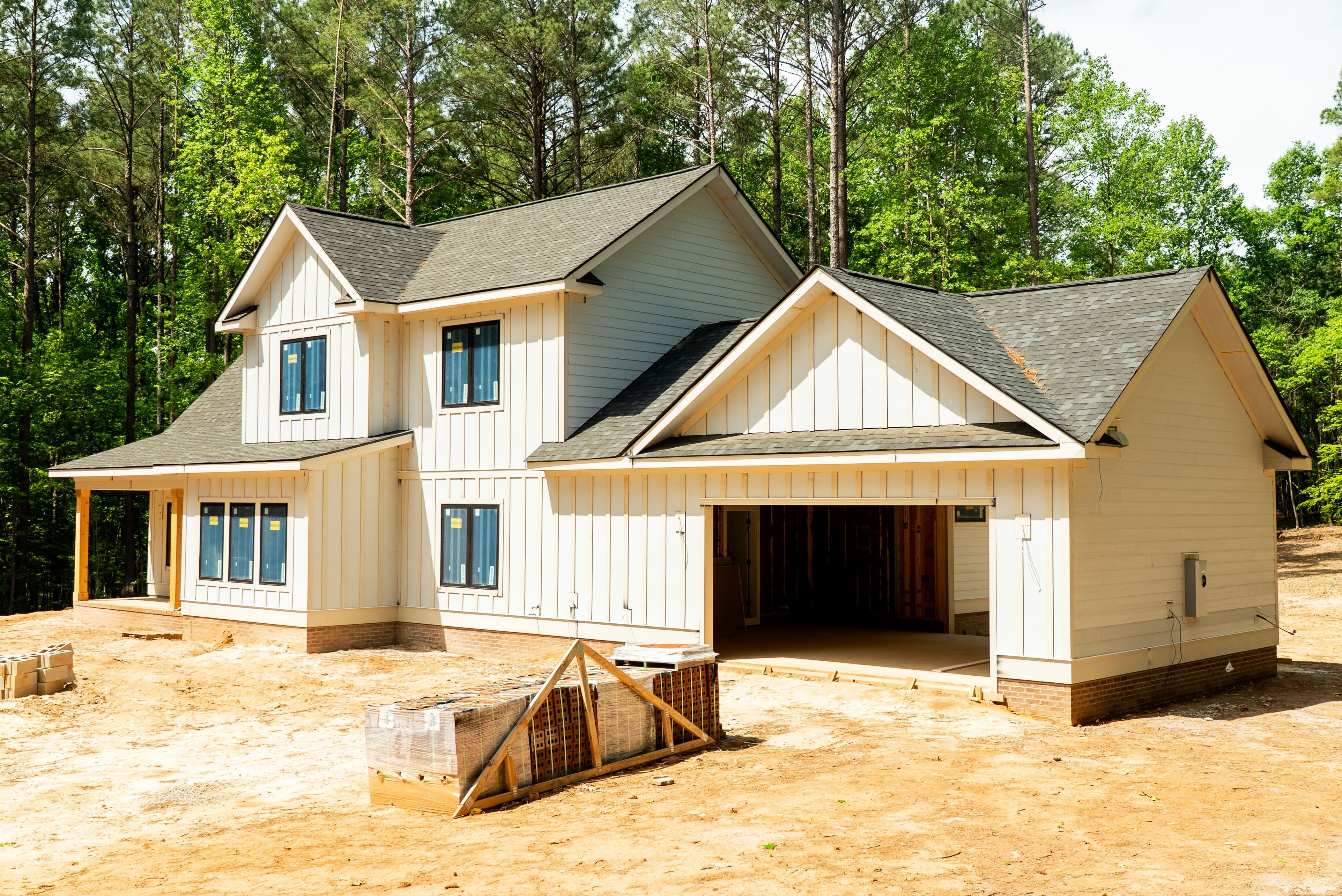 Custom home under construction with board-and-batten siding by South Eastern General Contractors in North Carolina