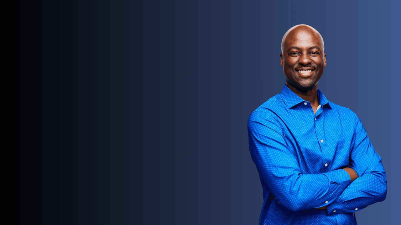 woman in blue tank top standing beside white wall
