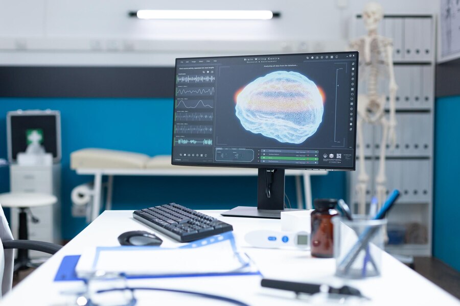 A consultation room having the image of a brain scan with other equipments of a doctor.