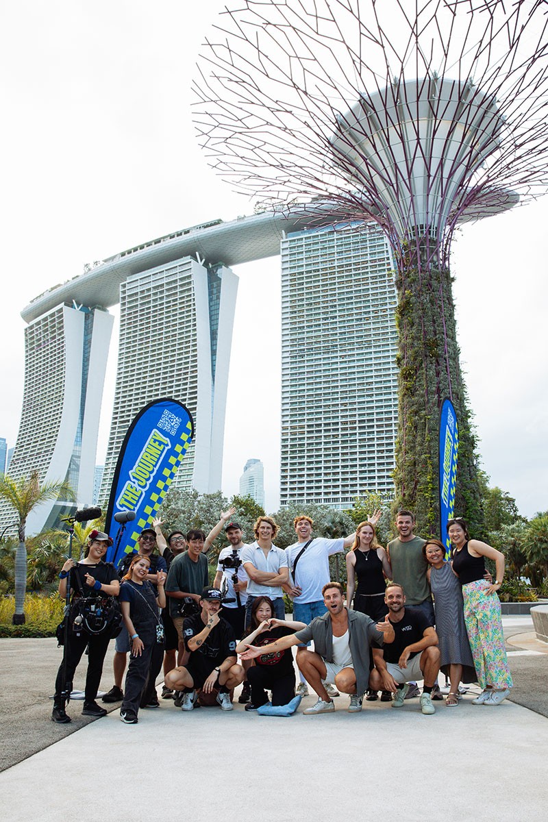 We Do Creative full production crew and creators at Gardens by the Bay with Marina Bay Sands in the background during the Visit Singapore — The Journey campaign