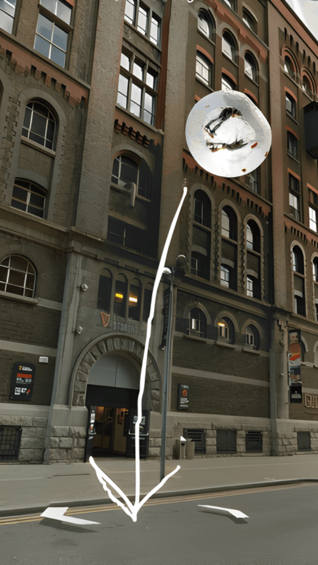 The bubble accelerates downward, tracked with motion arrows against a historic brick building