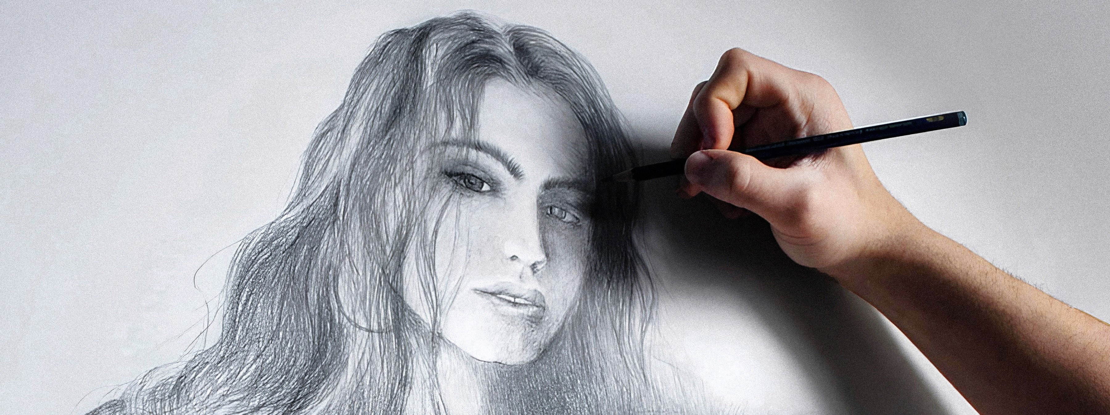 Close-up graphite portrait focusing on light, texture, and facial expression, revealing character through layered pencil strokes.