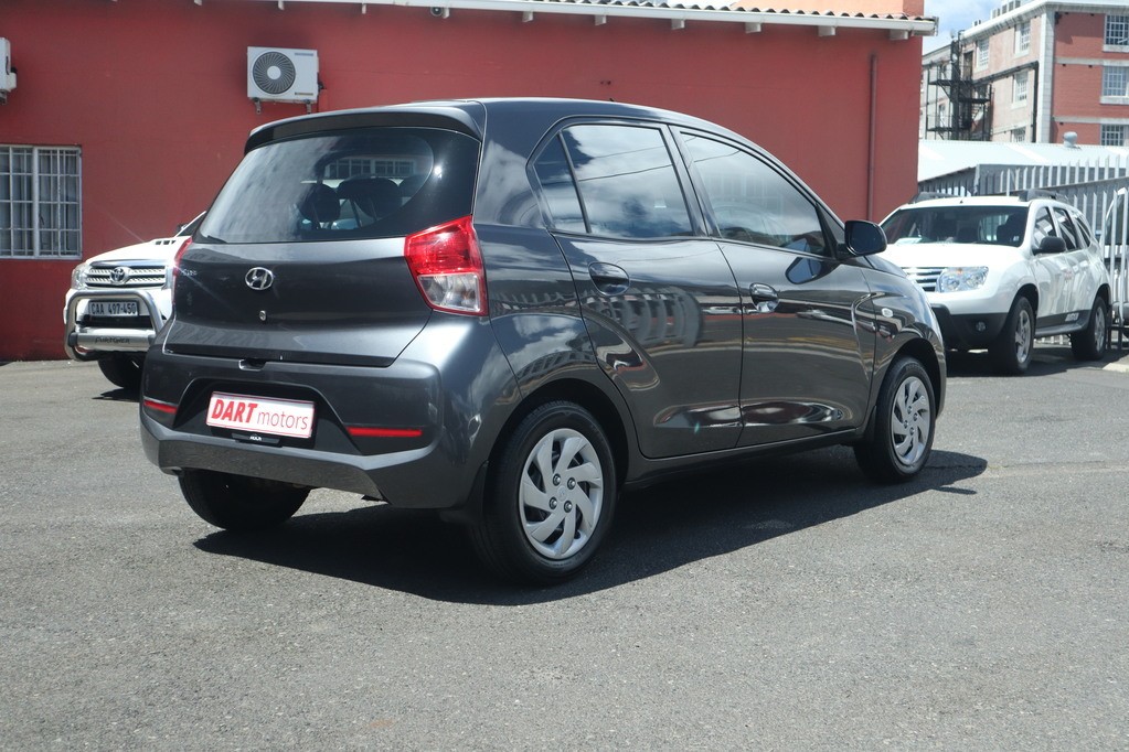 man in white crew neck shirt wearing black framed eyeglasses