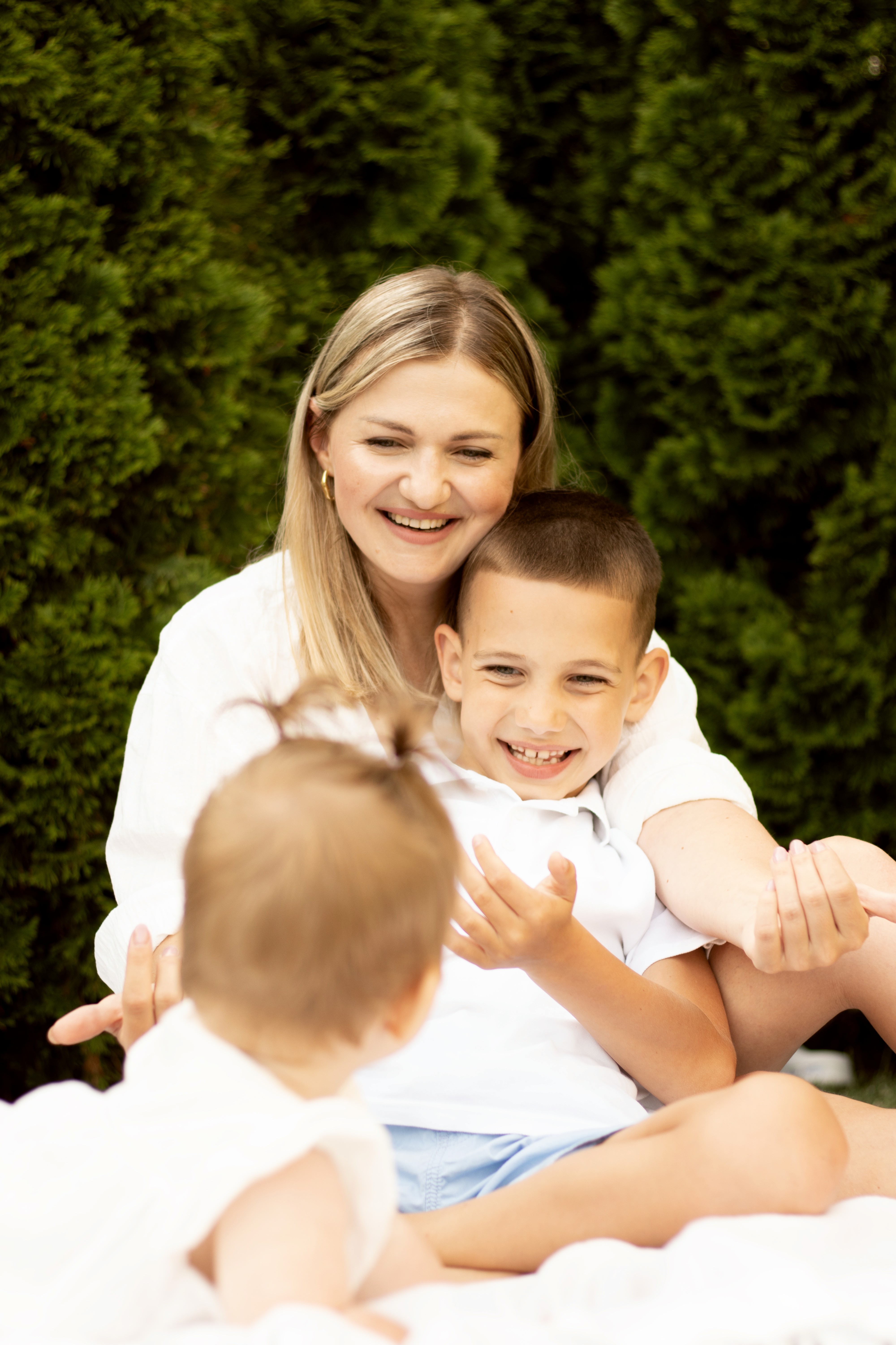 man in white shirt carrying girl in gray shirt