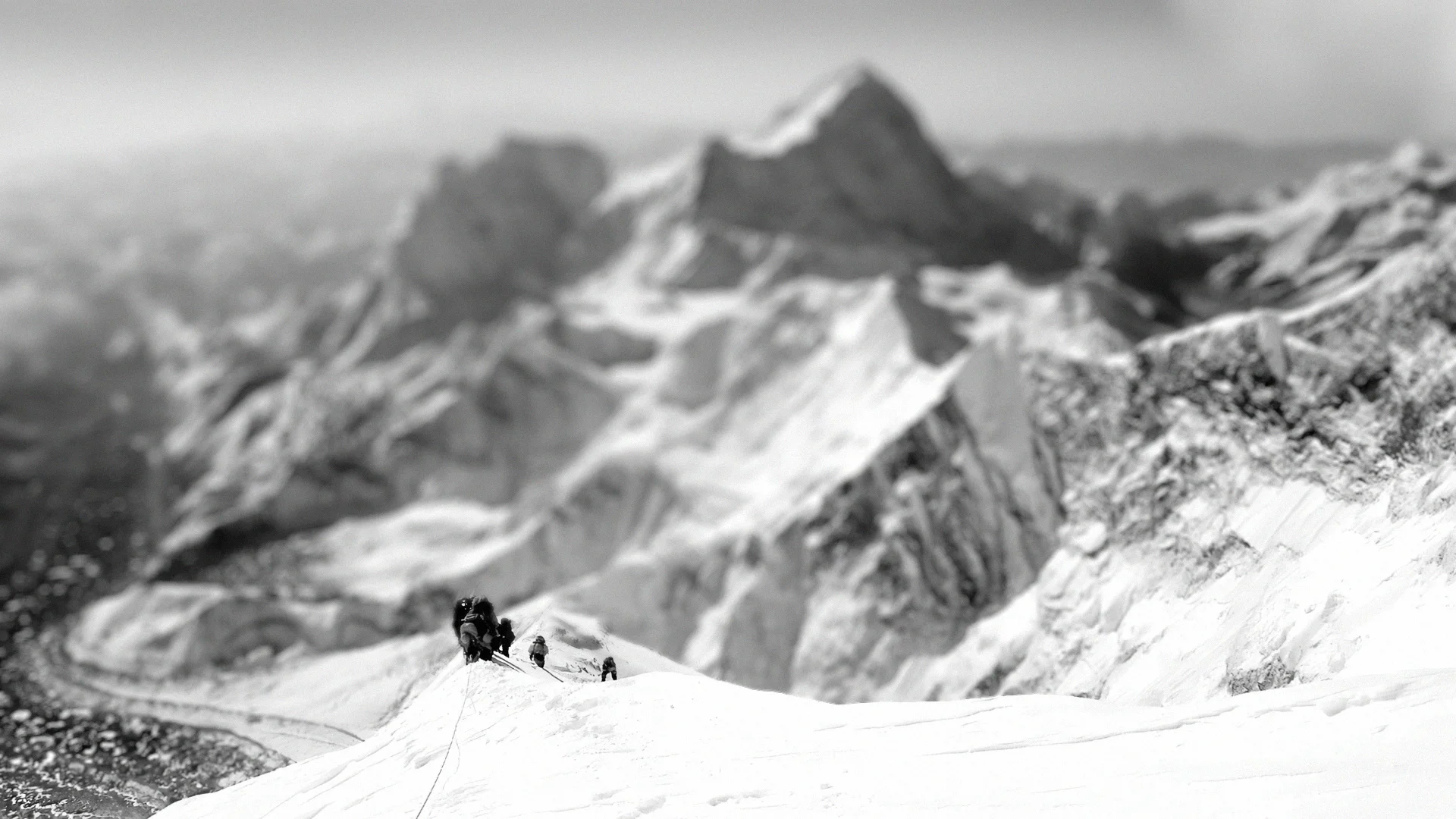 Sherpas guiding climbers up a mountain
