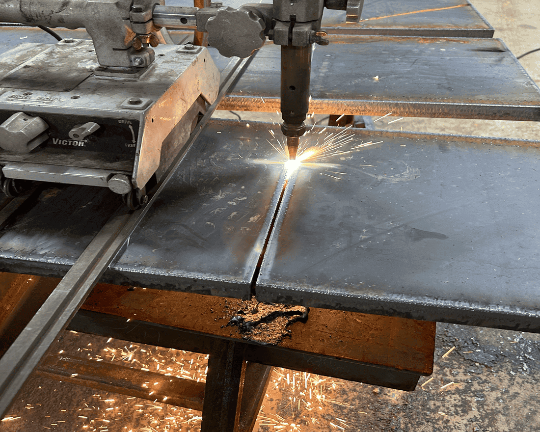 This is the Victor track torch being shown cutting through 1-1/4" steel plates.  With this Victor track torch we can cut large thick or thin materials with precision and ease.