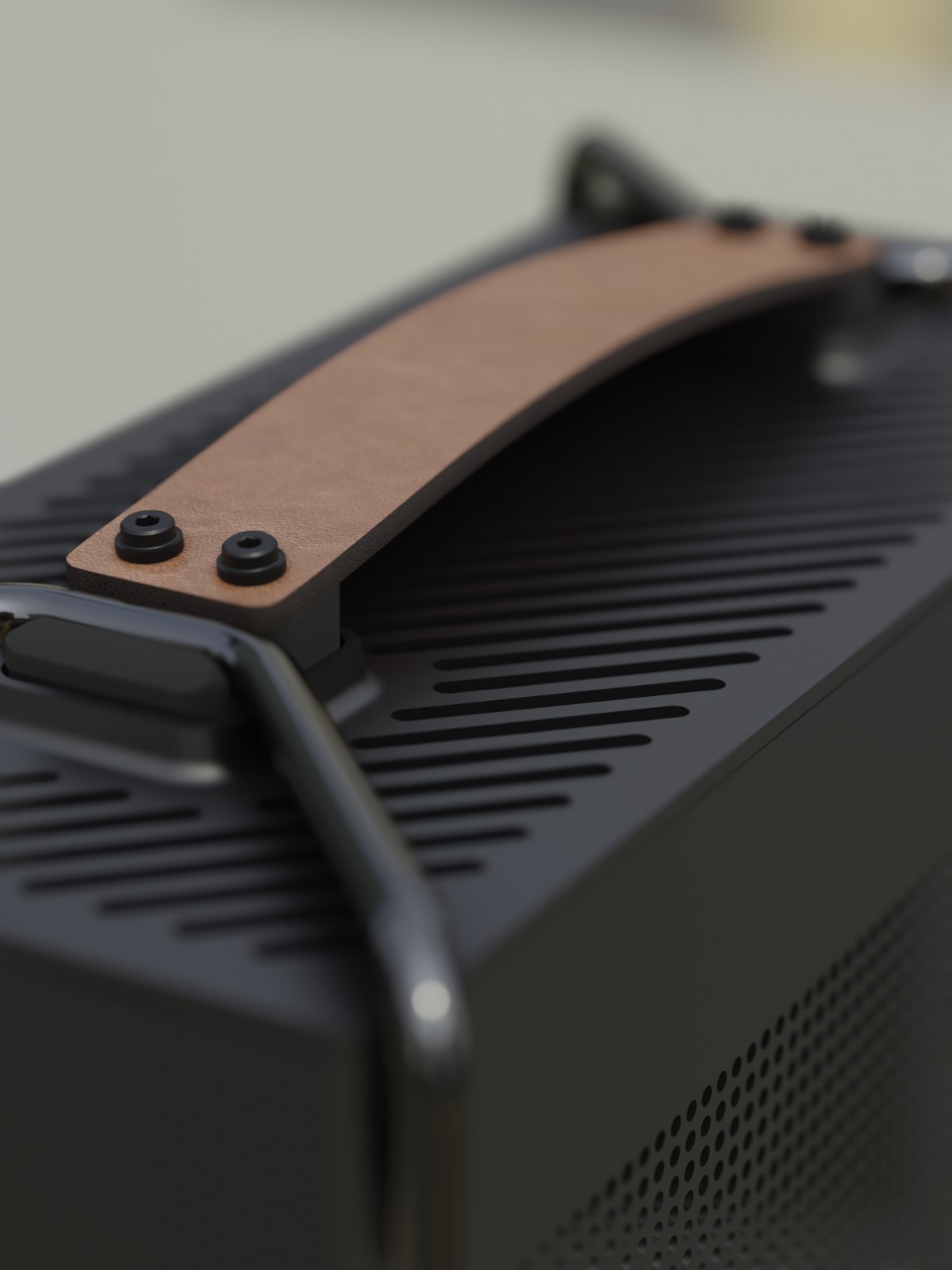Zoomed in detail of a leather handle on computer frame.