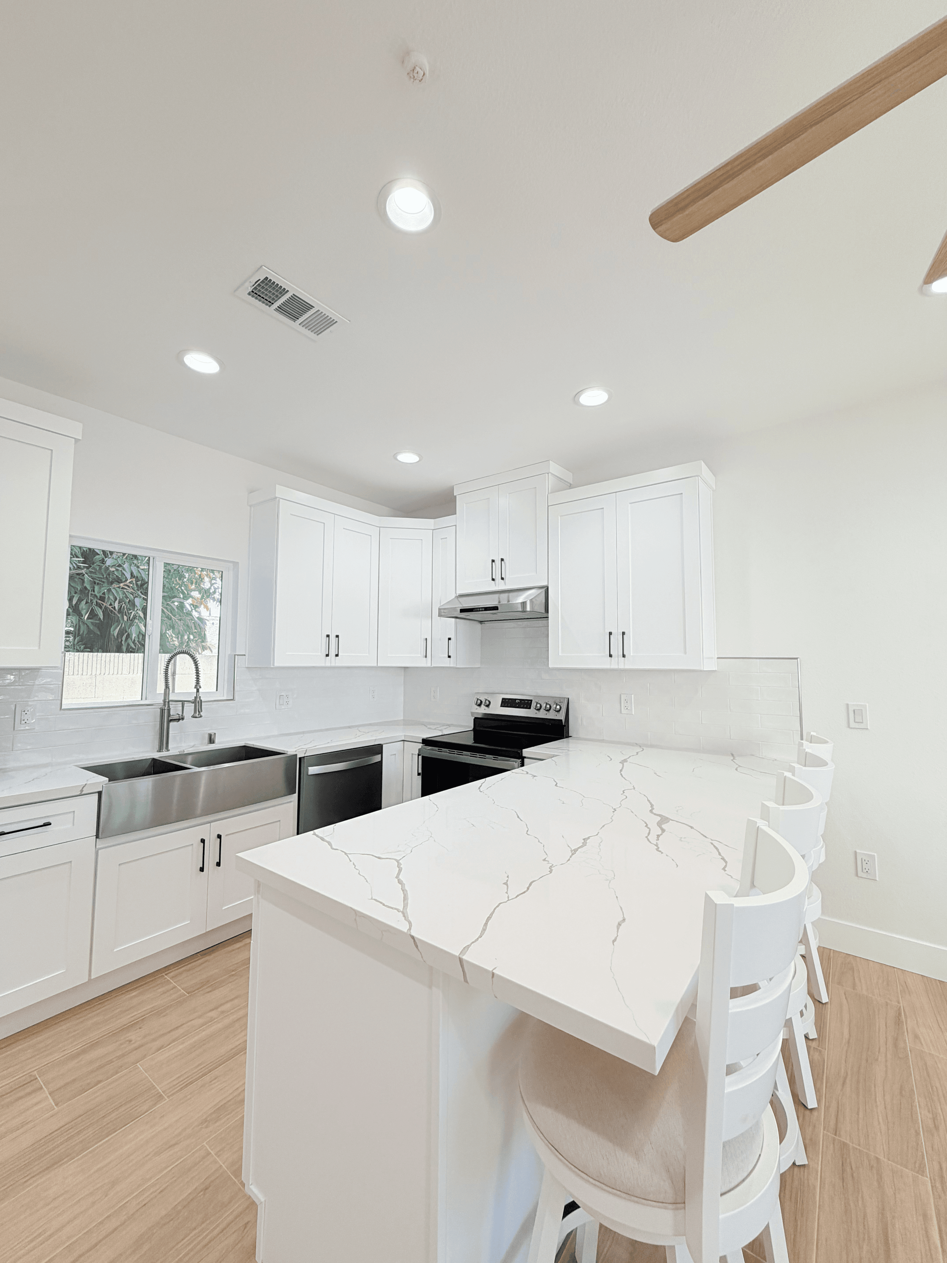 Modern ADU kitchen with upgraded cabinets and stainless steel appliances