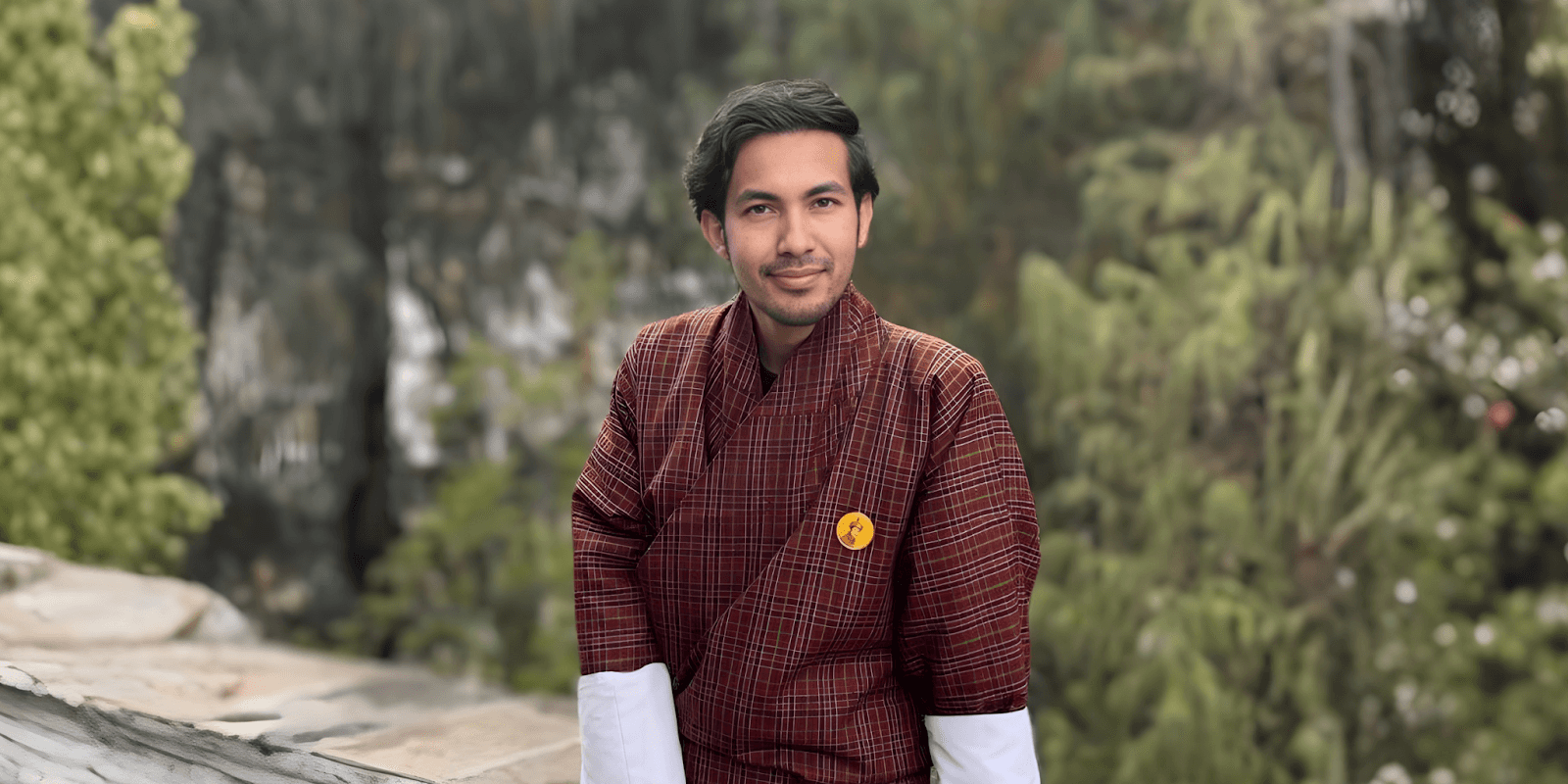 Tika R. Basnet in traditional Bhutanese attire, embodying the essence of Manifest Bhutan's transformative travel philosophy.