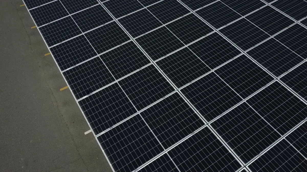Close drone view of commercial solar panels near Wasco, CA