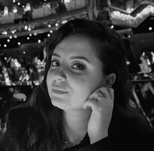 man sitting on a armchair beside window