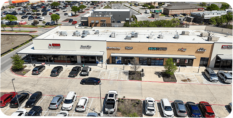 White and brown commercial strip mall building