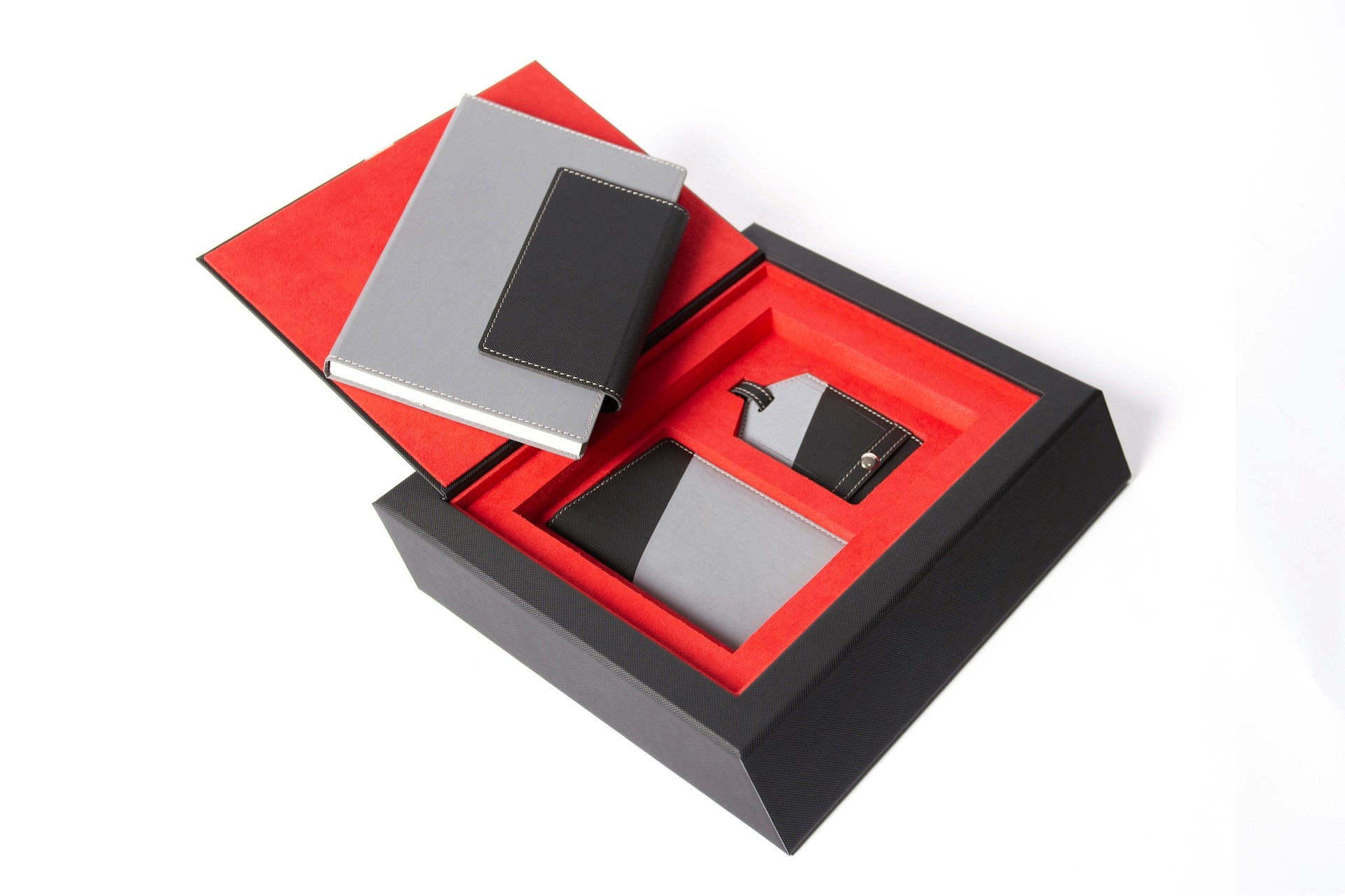 Luxury executive gift set with magnetic closure box and red suede interior featuring custom journal
