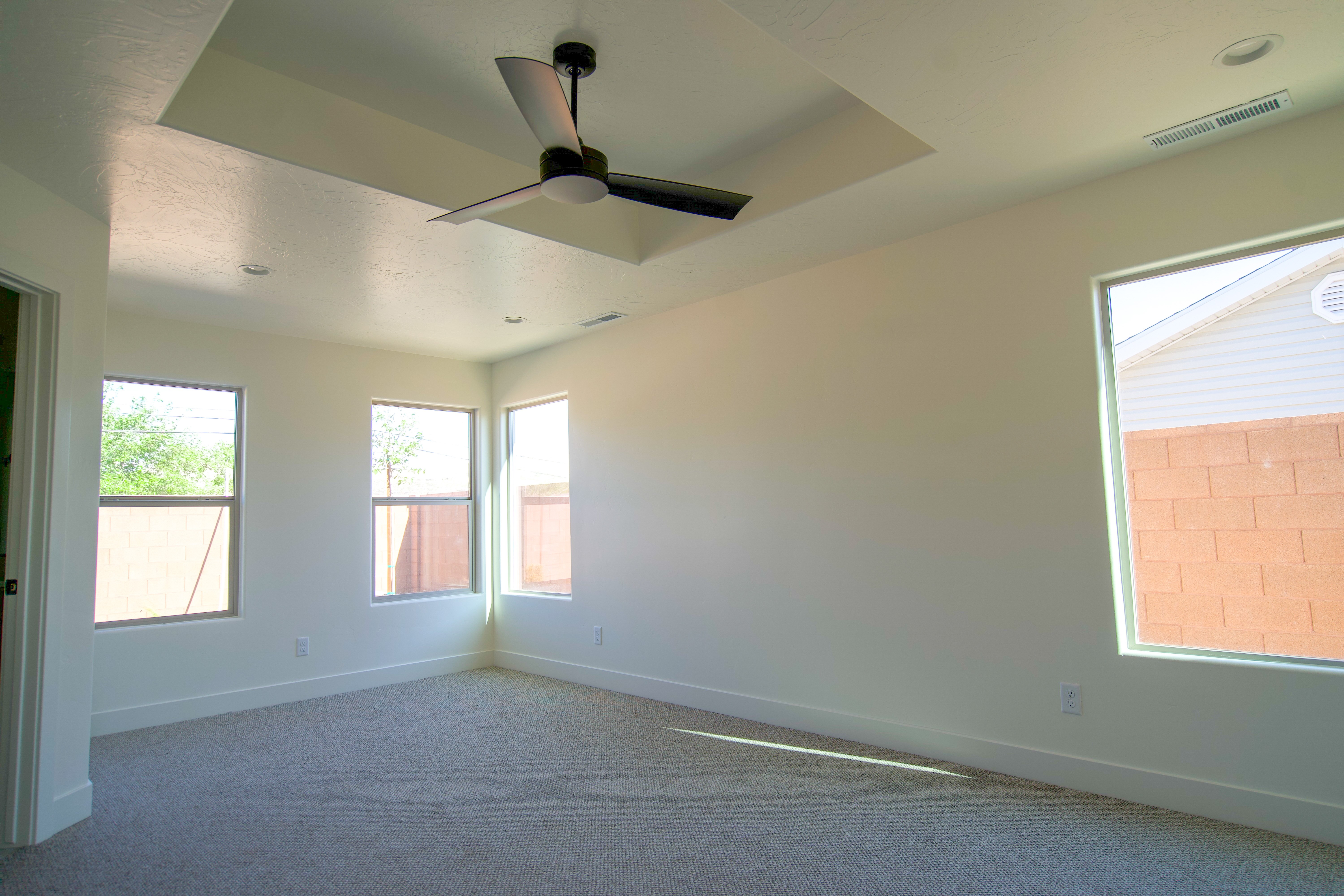 Modern bedroom in Southern Utah home remodel with clean design and soft tones.