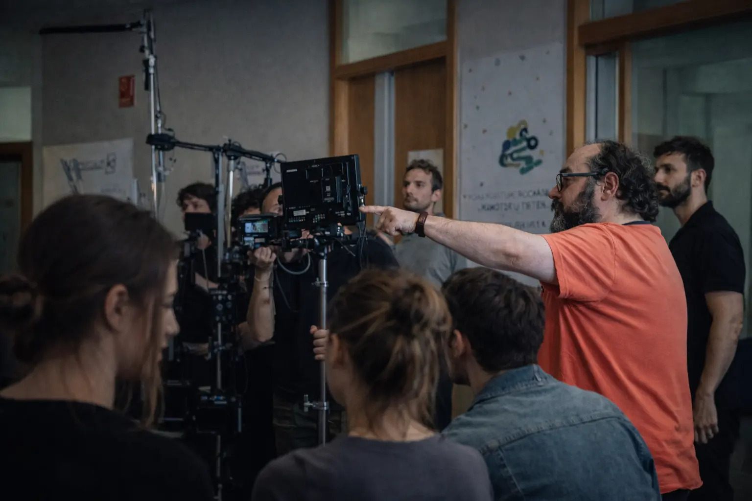 a man standing in a kitchen next to a woman