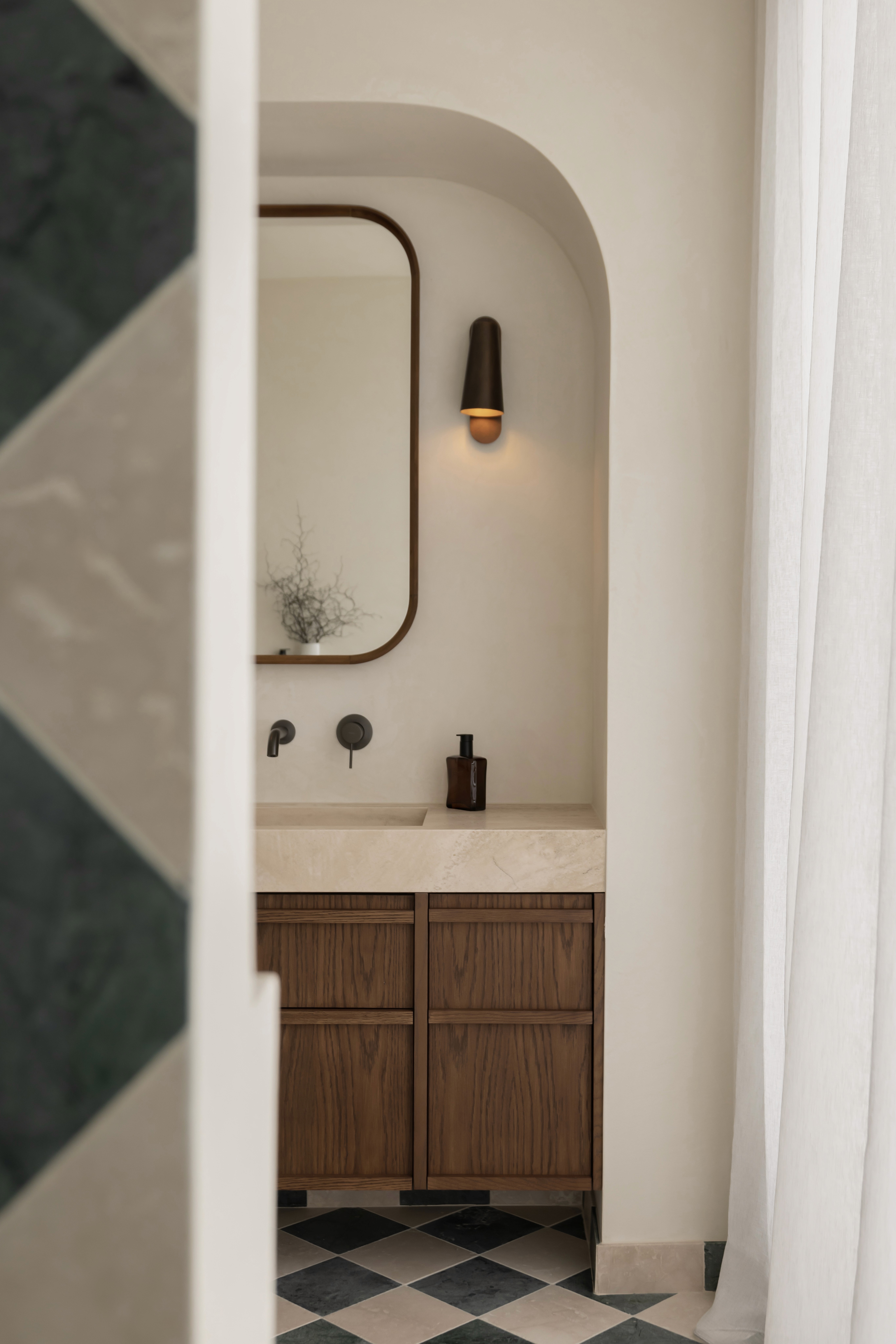 interior design photography of a modern bathroom with curves and warm features