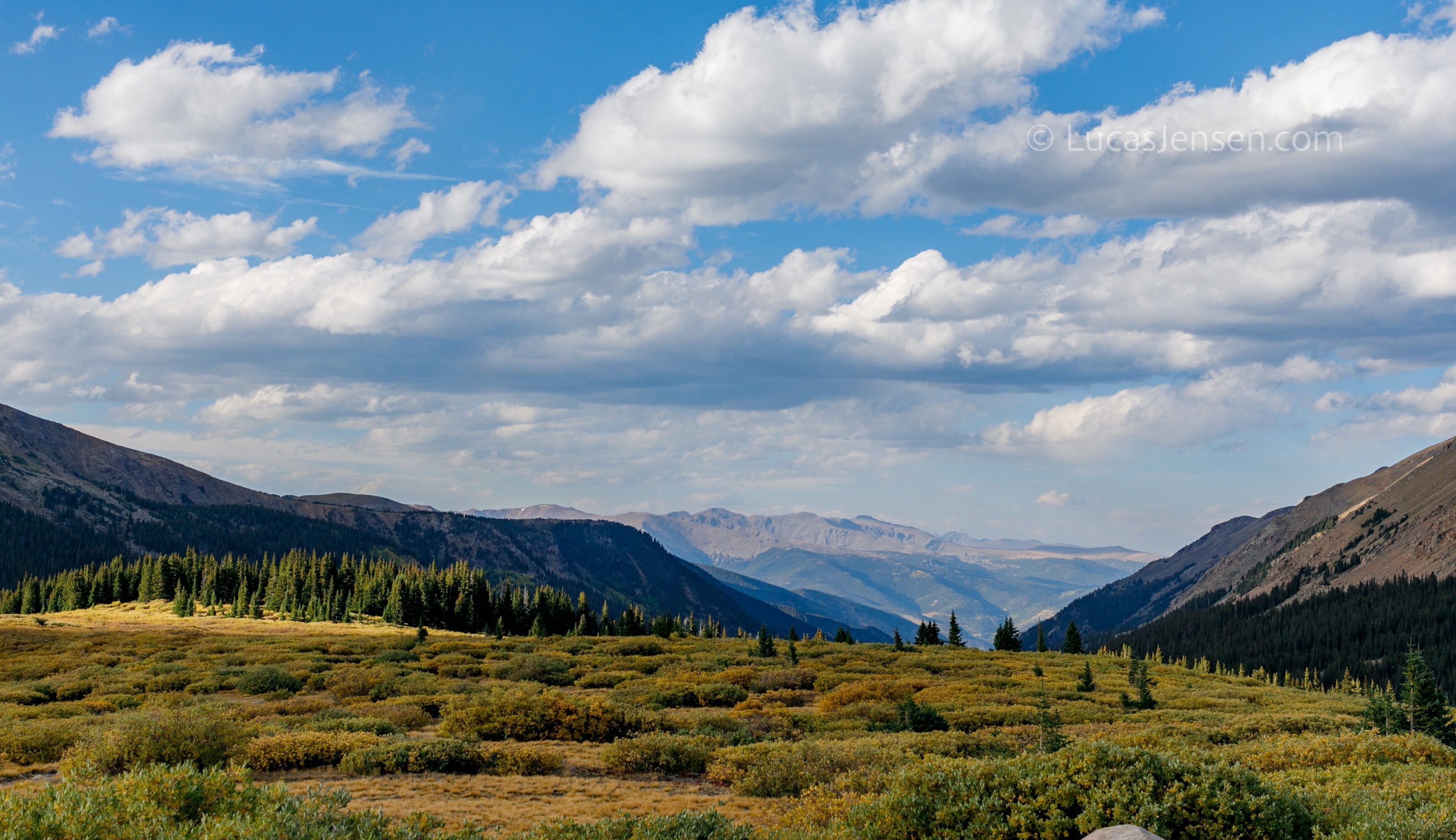 landscape photograph of mountains, water, desert, or coast by Lucas Jensen