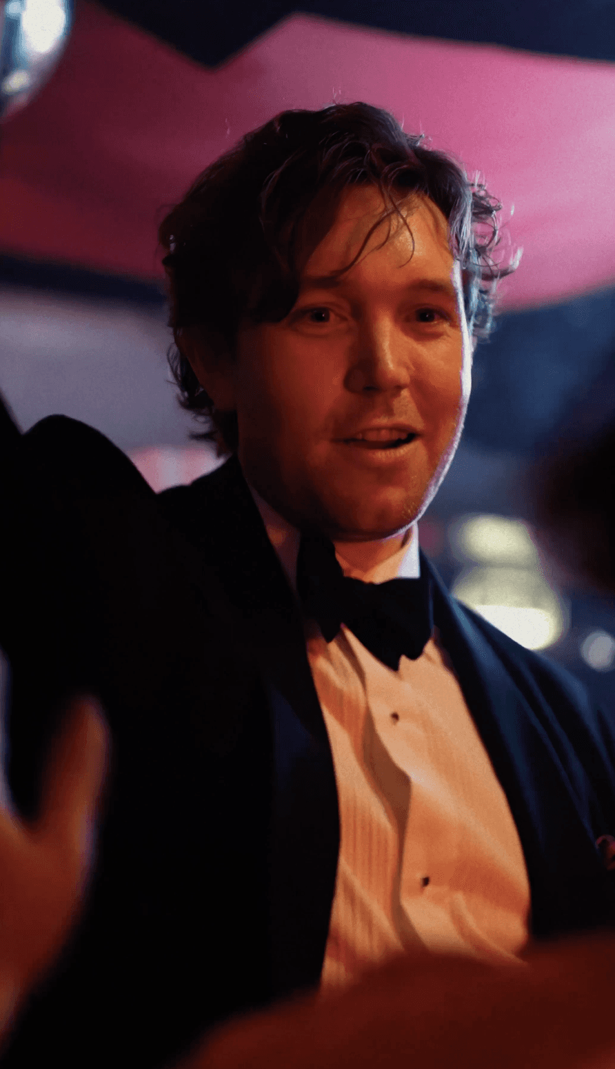 Woman in black outfit sitting on floor