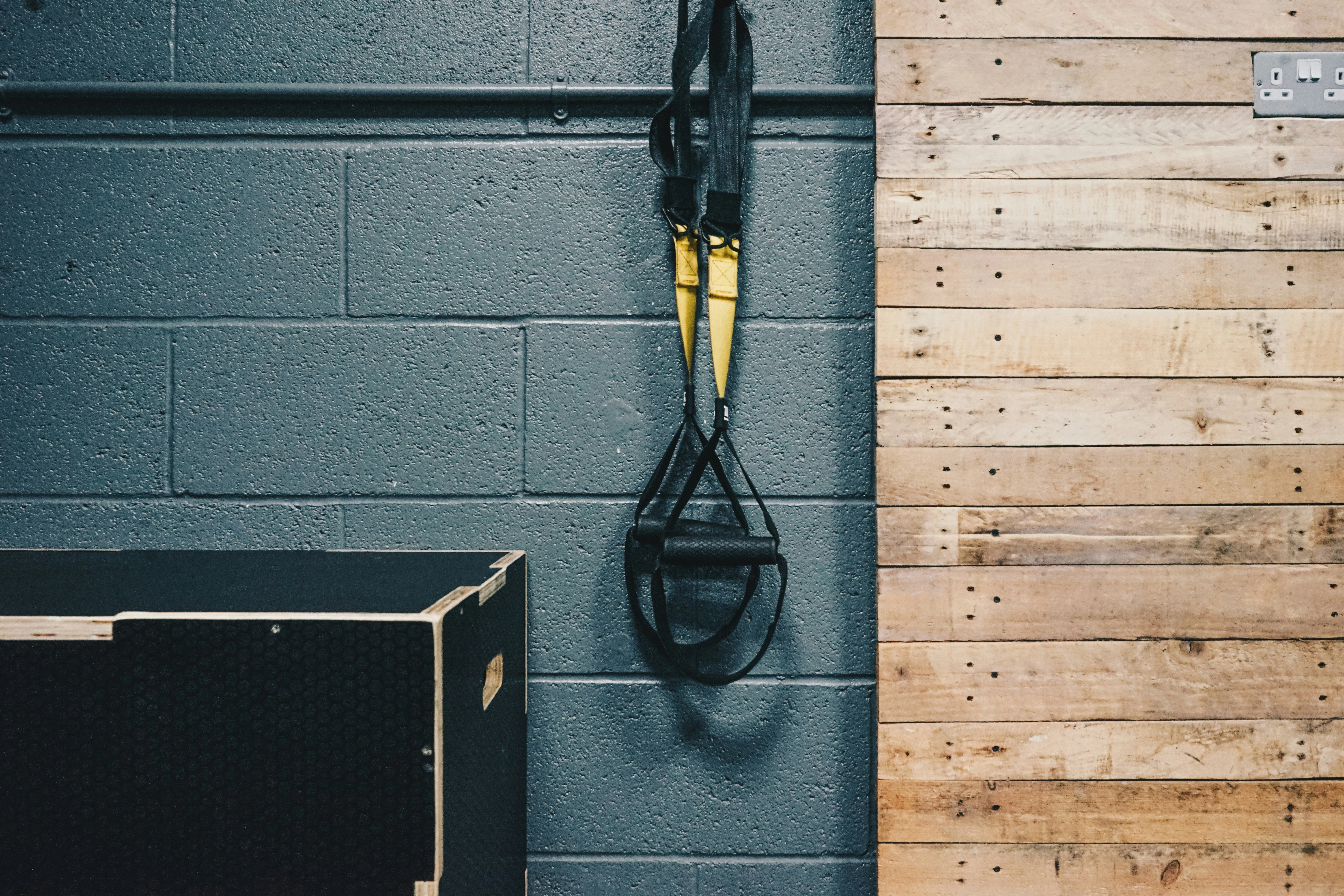 suspension training straps mounted on a wall