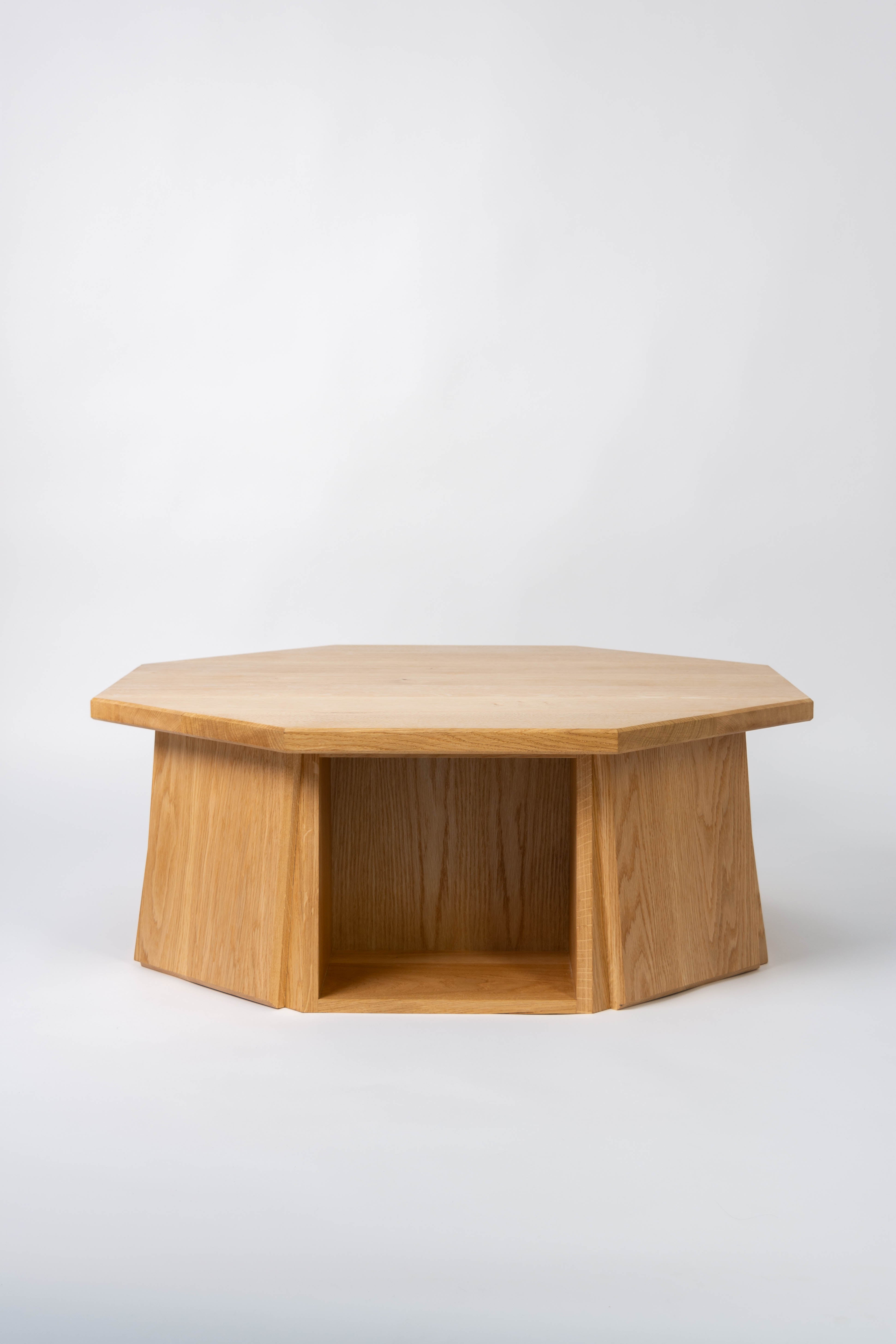 Octagonal wooden coffee table on a white background