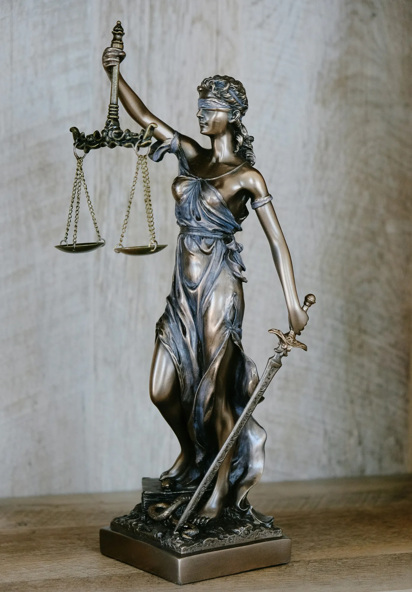 Statue of Lady Justice holding scales and a sword