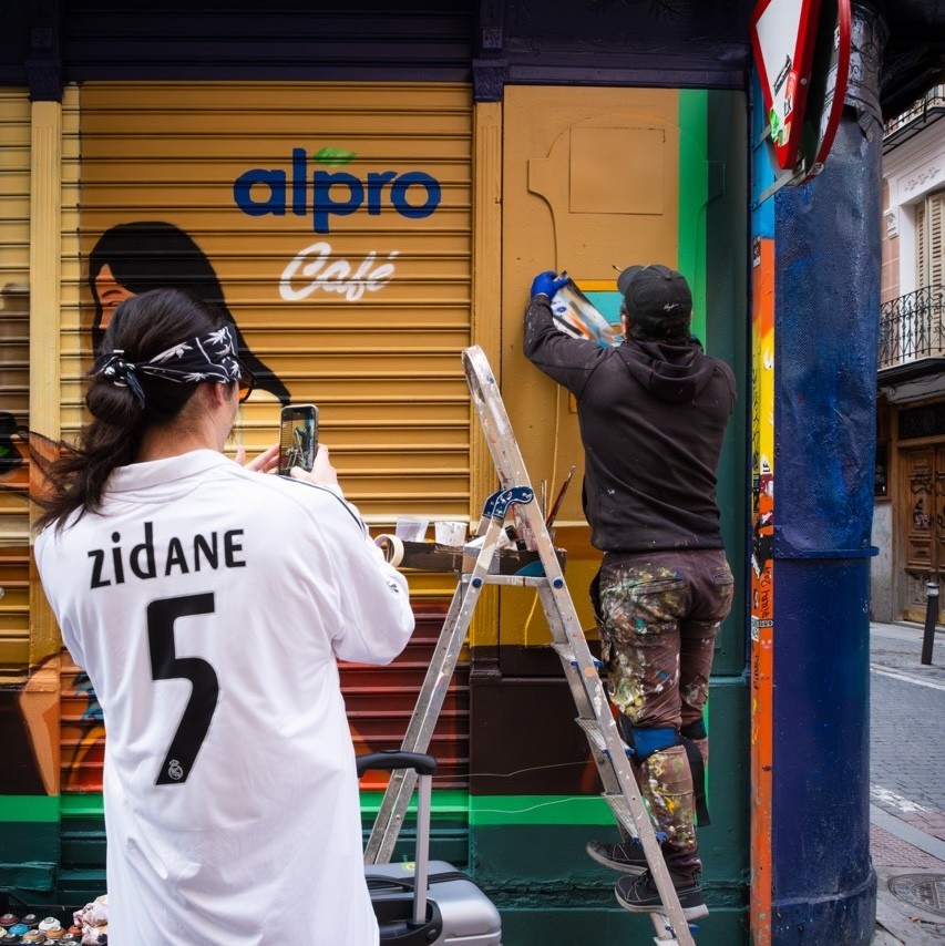 Woman wears a blue coat in a blue environment.