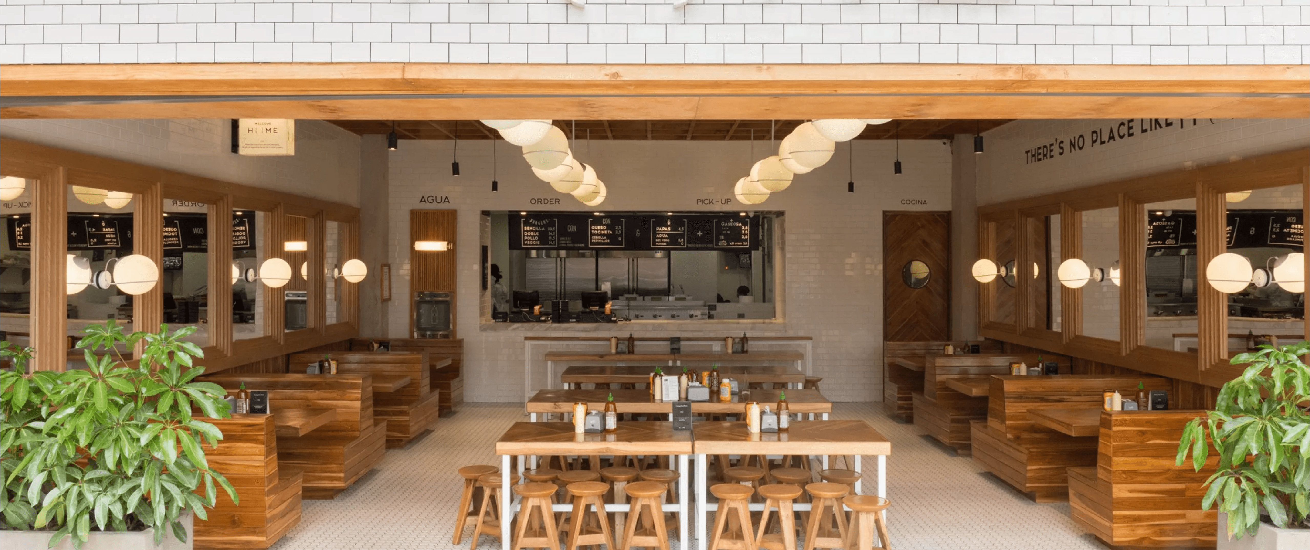 twins posing in front of a car