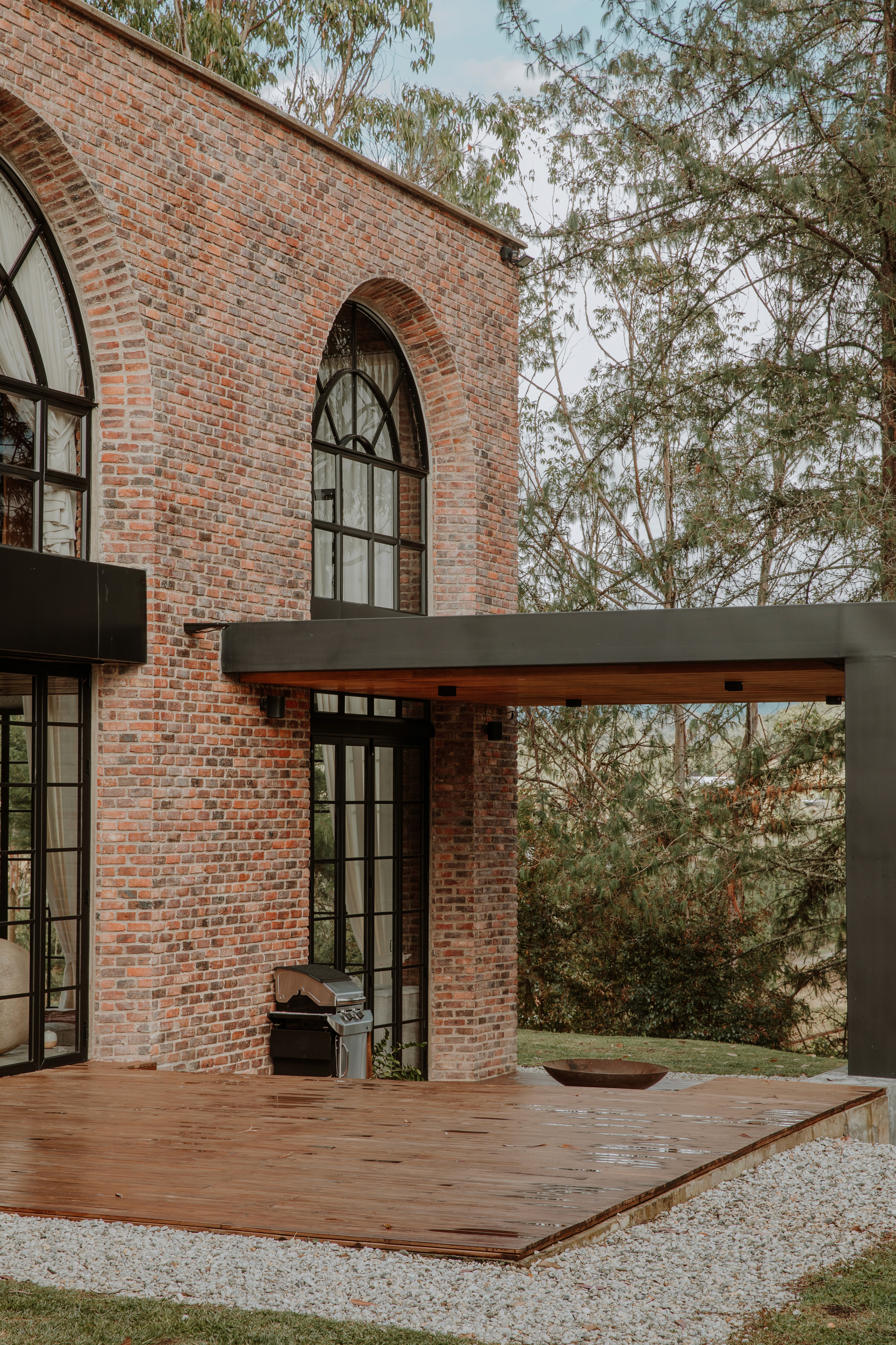 Double-height interior with flowing sculptural forms and warm raking light